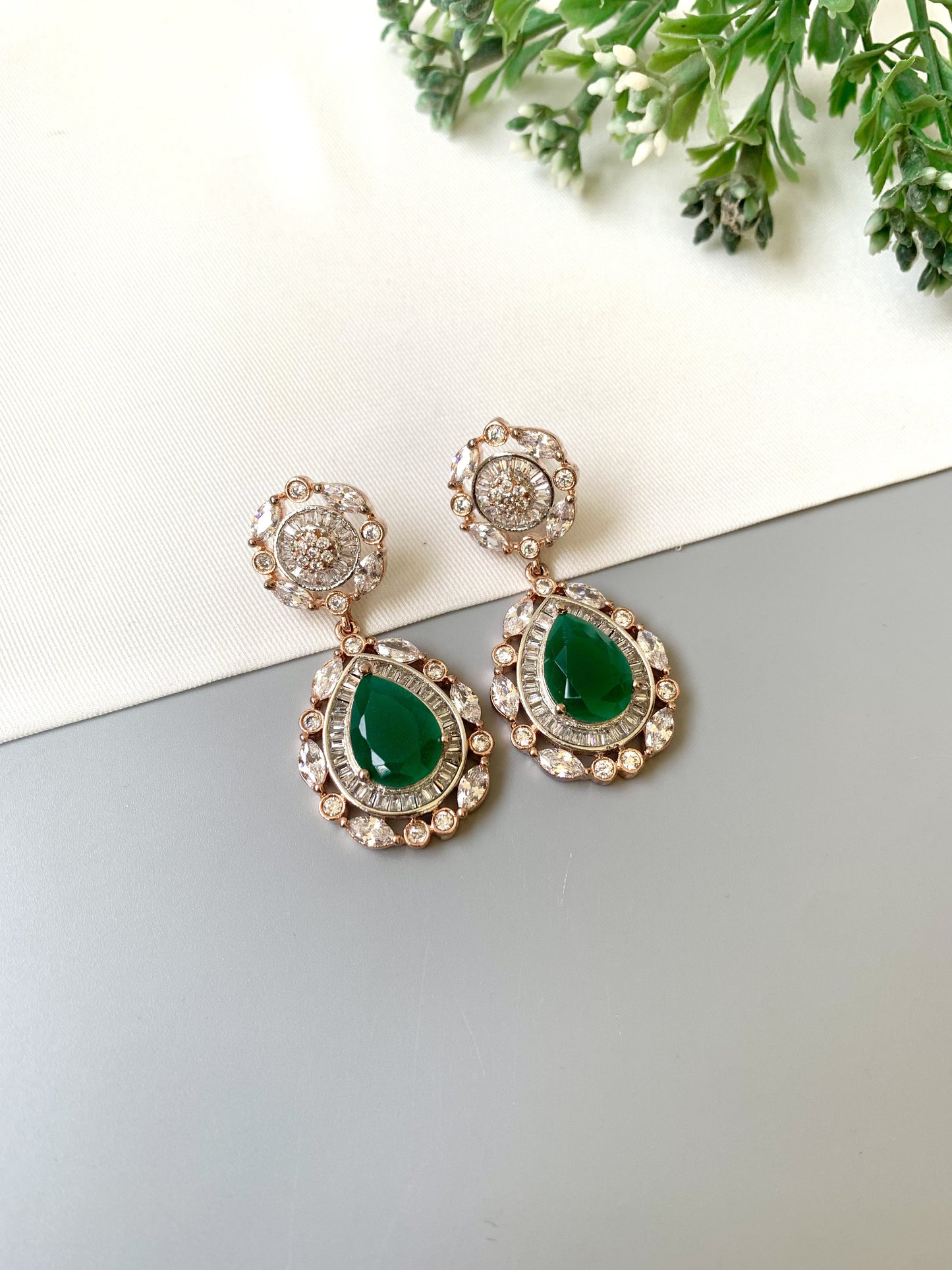 Handcrafted Victorian rose gold earrings with semi-precious emeralds and American diamonds by Zamal Jewels.