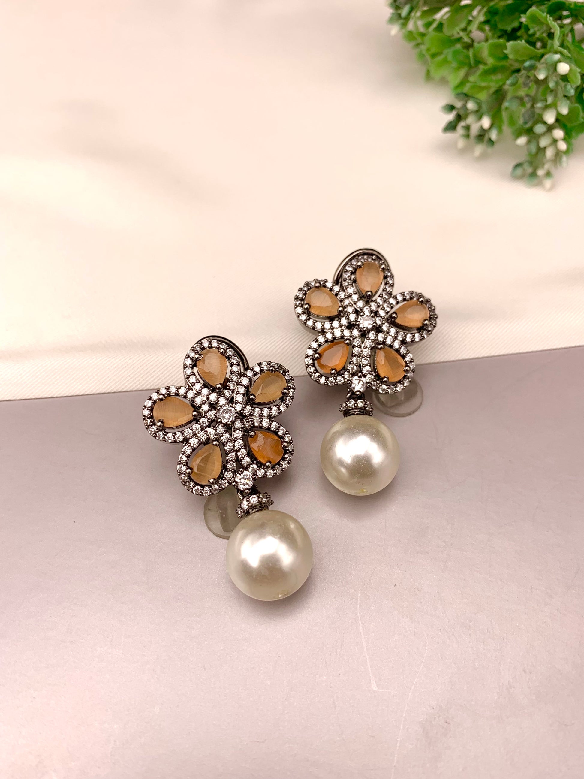 Ermina handcrafted rhodium plated oxidized earrings featuring American Diamonds, semi-precious Onyx and Pearls