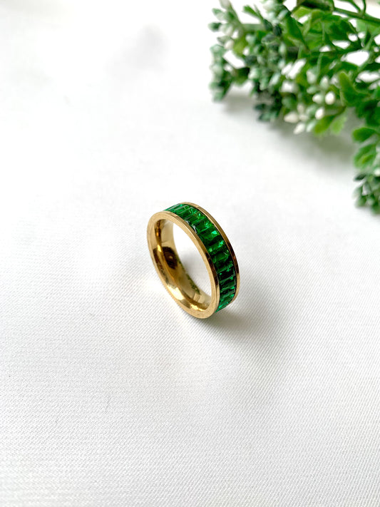 Esmera gold band ring with green baguette-cut crystals, 22K gold plated on 316L stainless steel by Zamal Jewels.