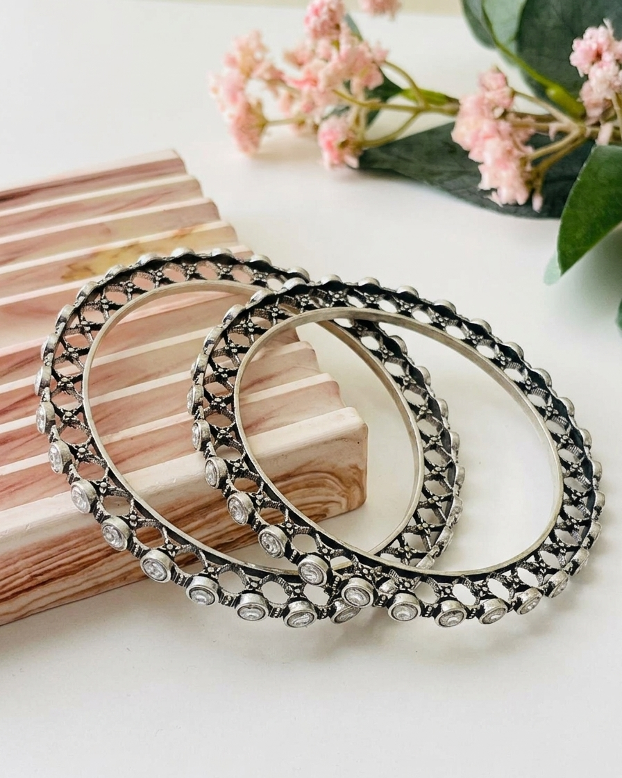 Eve handcrafted rhodium plated bangles with oxidized black polish and high quality Polki Kundan, sold as a pair