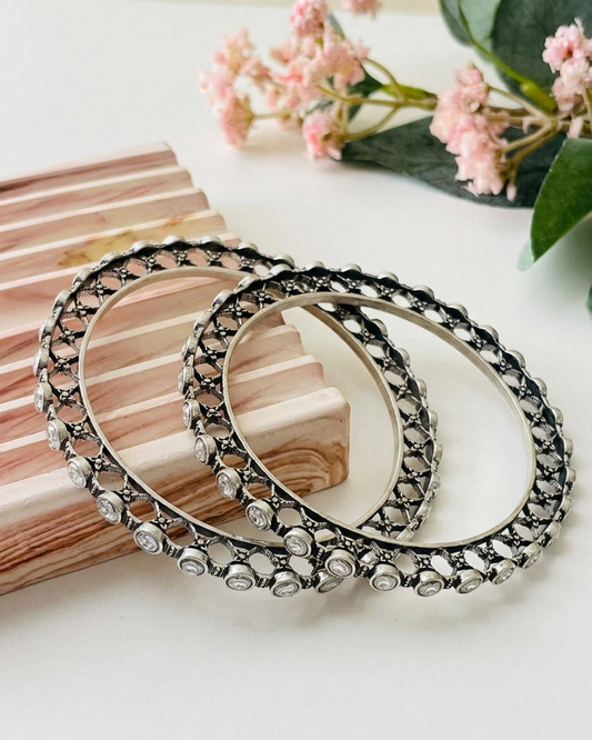 Eve handcrafted rhodium plated bangles with oxidized black polish and high quality Polki Kundan, sold as a pair