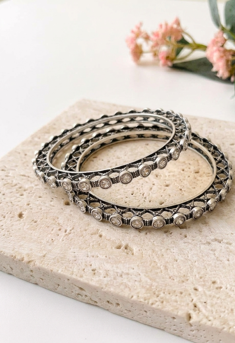 Eve handcrafted rhodium plated bangles with oxidized black polish and high quality Polki Kundan, sold as a pair