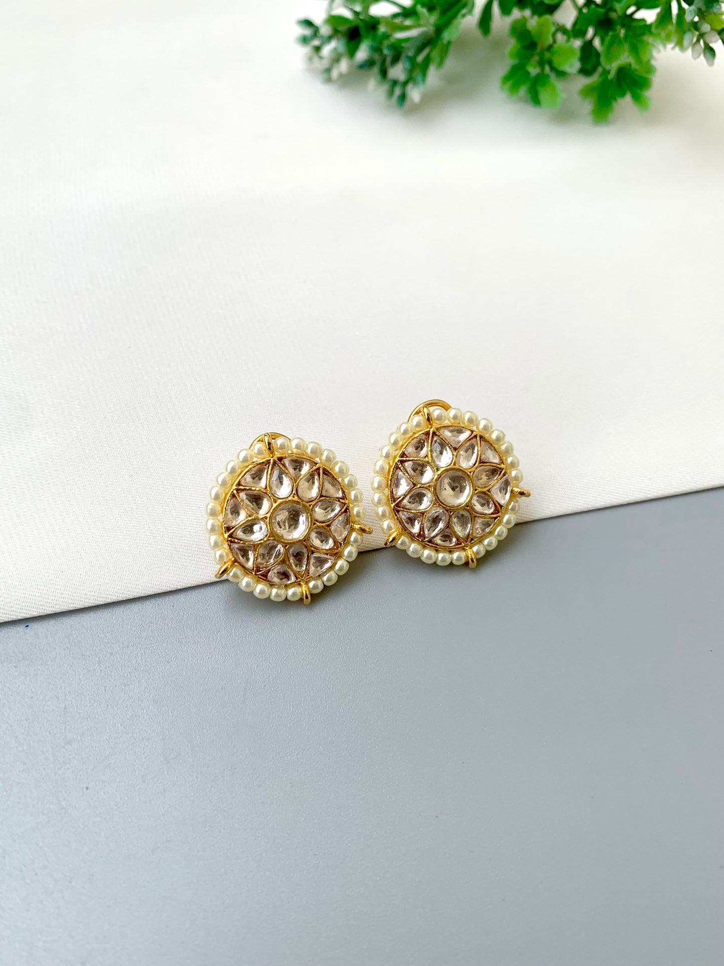 Geeta handcrafted 22kt gold plated studs featuring high-quality Polki Kundan and semi-precious pearls