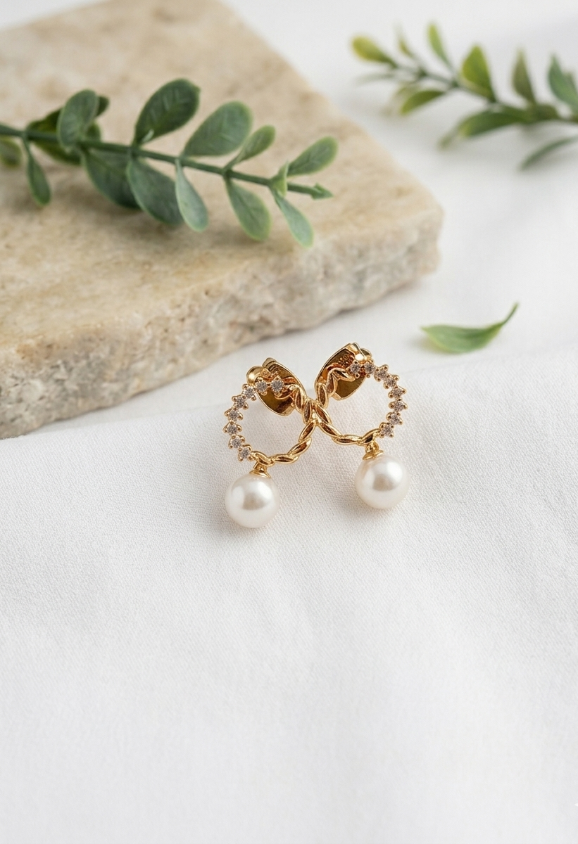 Ikna gold plated studs with American diamonds and pearl accents