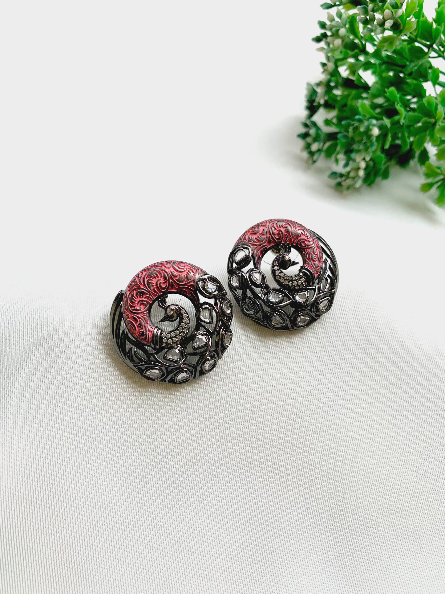Madhu handcrafted peacock studs with American Diamonds, Polki Kundan and hand-painted Meena in black oxidized rhodium finish