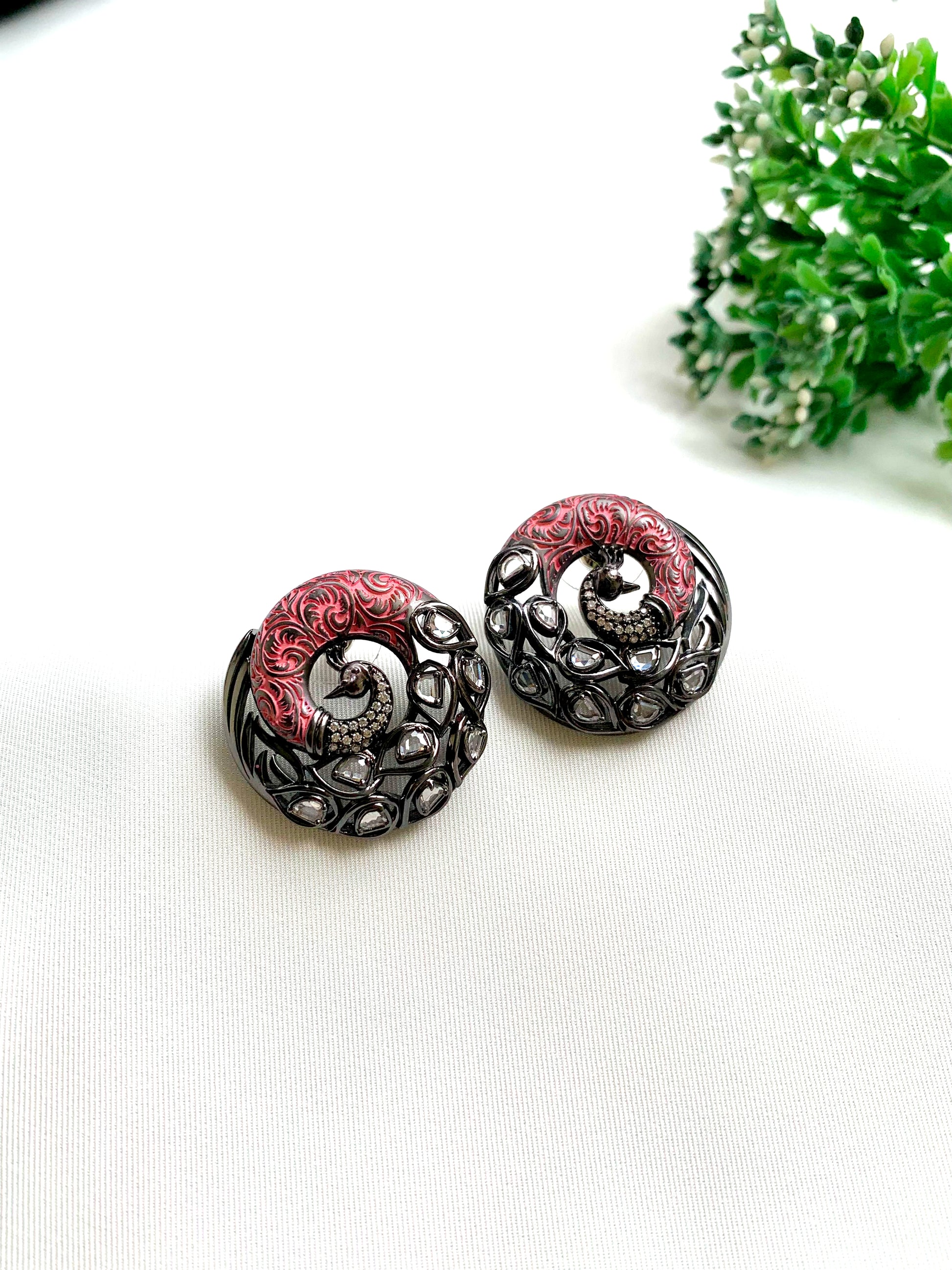 Madhu handcrafted peacock studs with American Diamonds, Polki Kundan and hand-painted Meena in black oxidized rhodium finish