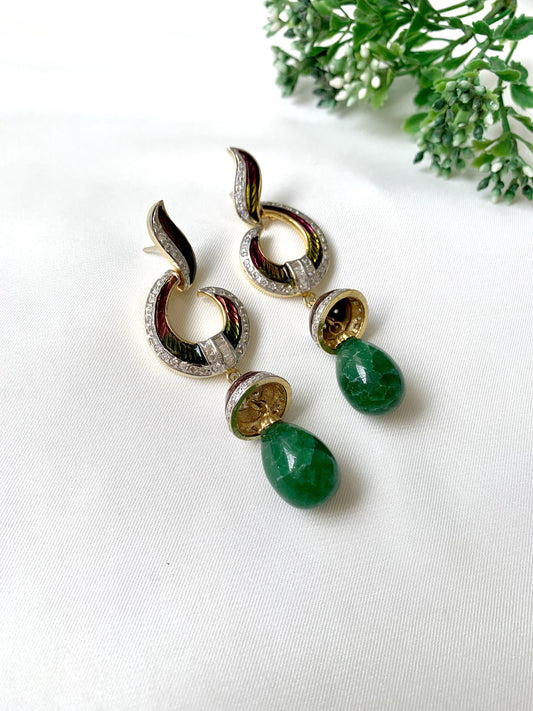 Handcrafted emerald jhumka earrings with American Diamonds and hand-painted Meena detailing in gold-tone finish