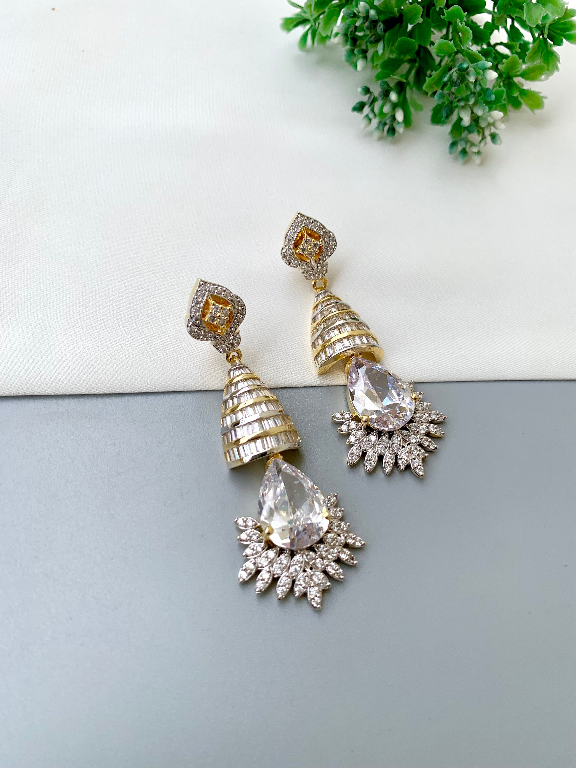 Naaz handcrafted 22kt Gold plated earrings featuring high-quality American Diamonds