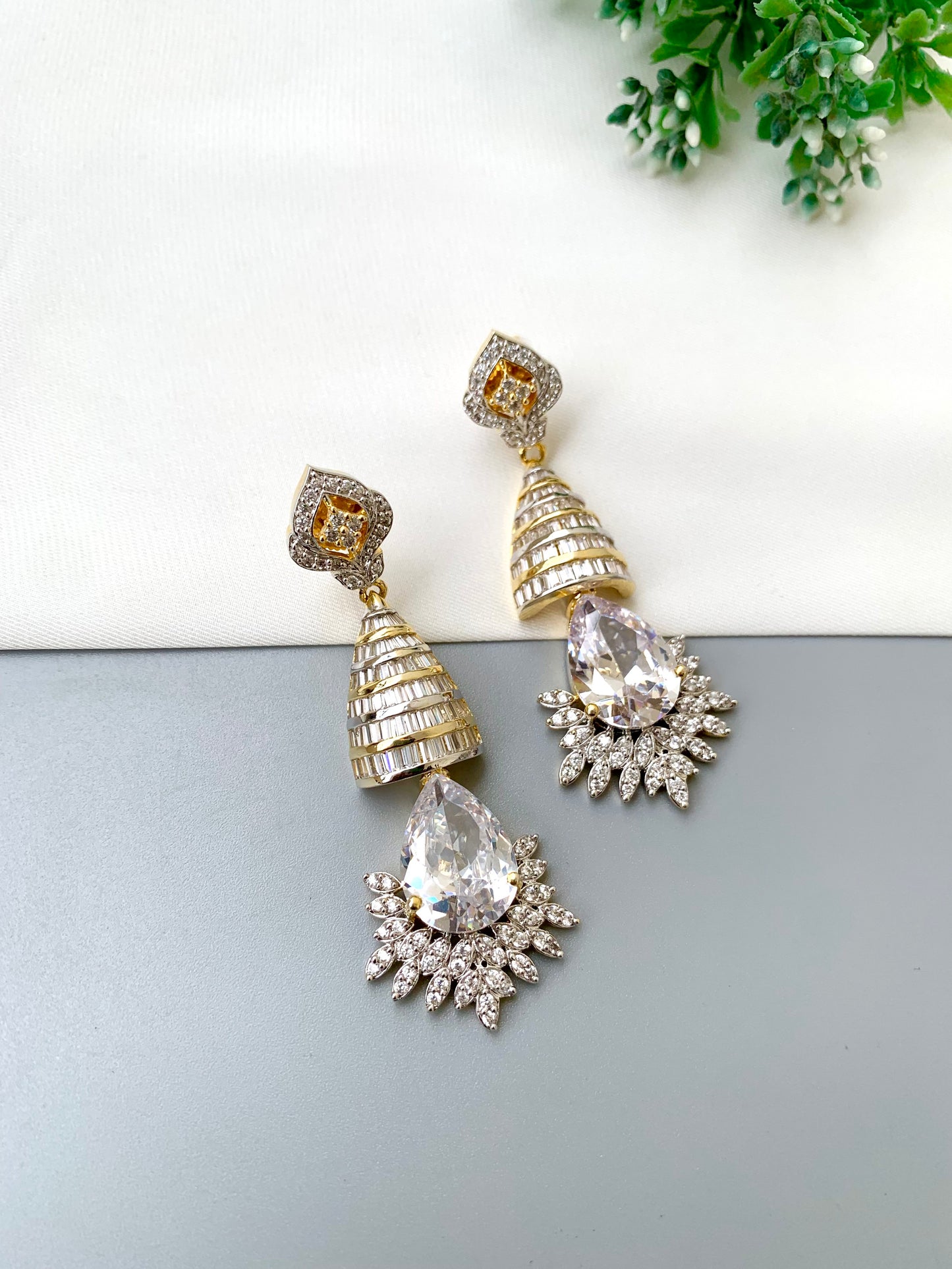 Naaz handcrafted 22kt Gold plated earrings featuring high-quality American Diamonds