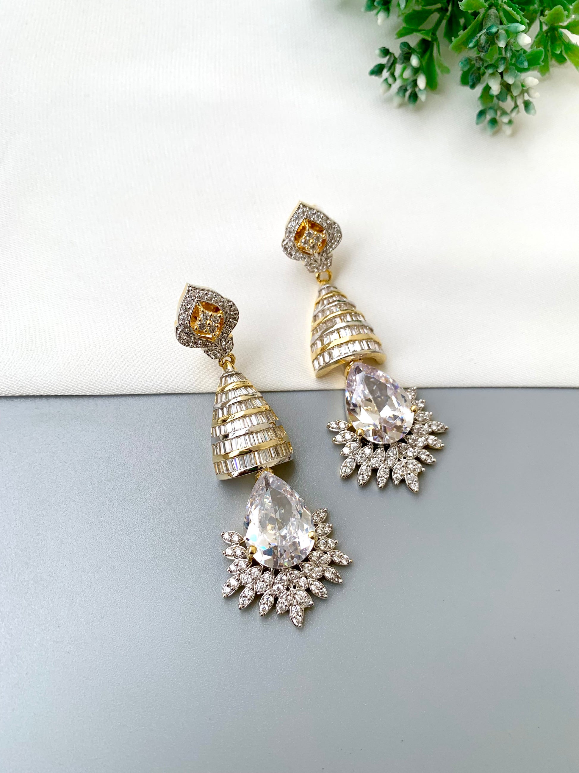 Naaz handcrafted 22kt Gold plated earrings featuring high-quality American Diamonds