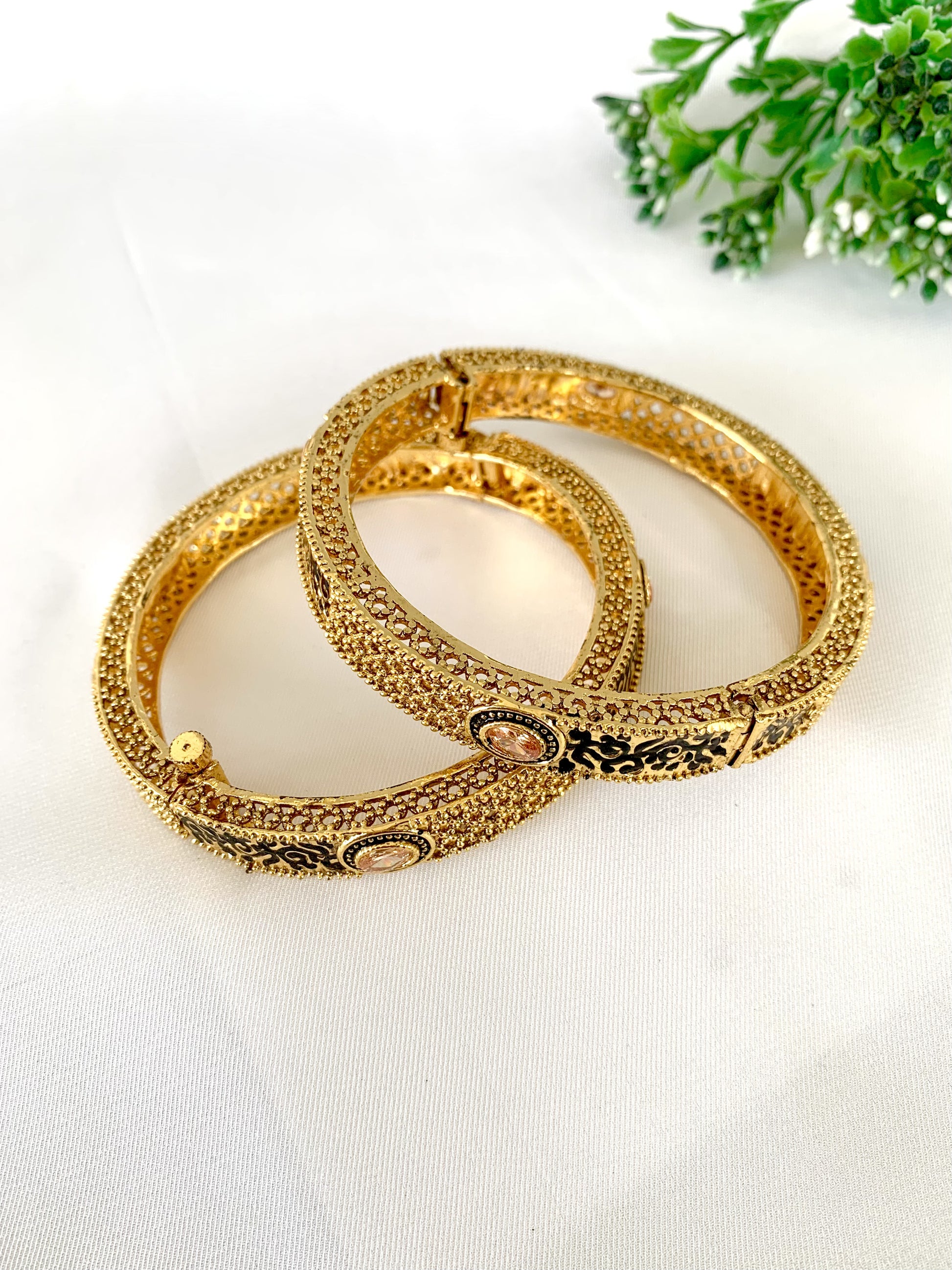 Hand-painted Meena bangles with champagne stones on white background