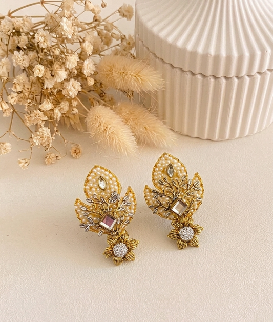 Naghma handcrafted earrings featuring American Diamonds, Kundan, and semi-precious Pearls, available in White (22kt gold plated) and Pink (rhodium plated) variants