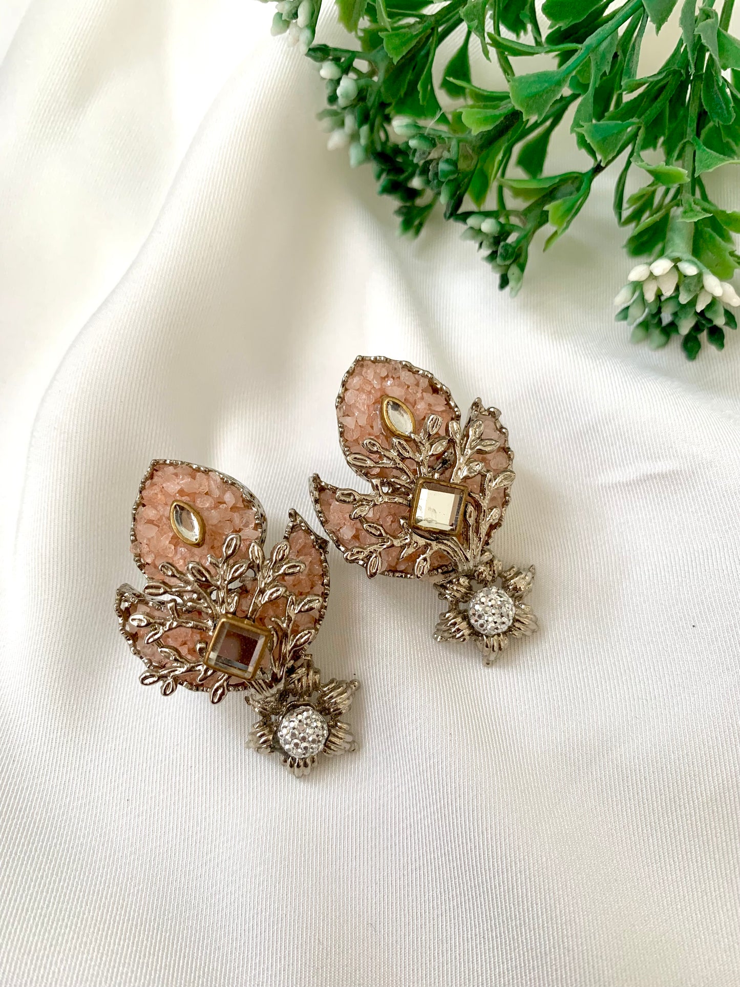Naghma handcrafted earrings featuring American Diamonds, Kundan, and semi-precious Pearls, available in White (22kt gold plated) and Pink (rhodium plated) variants