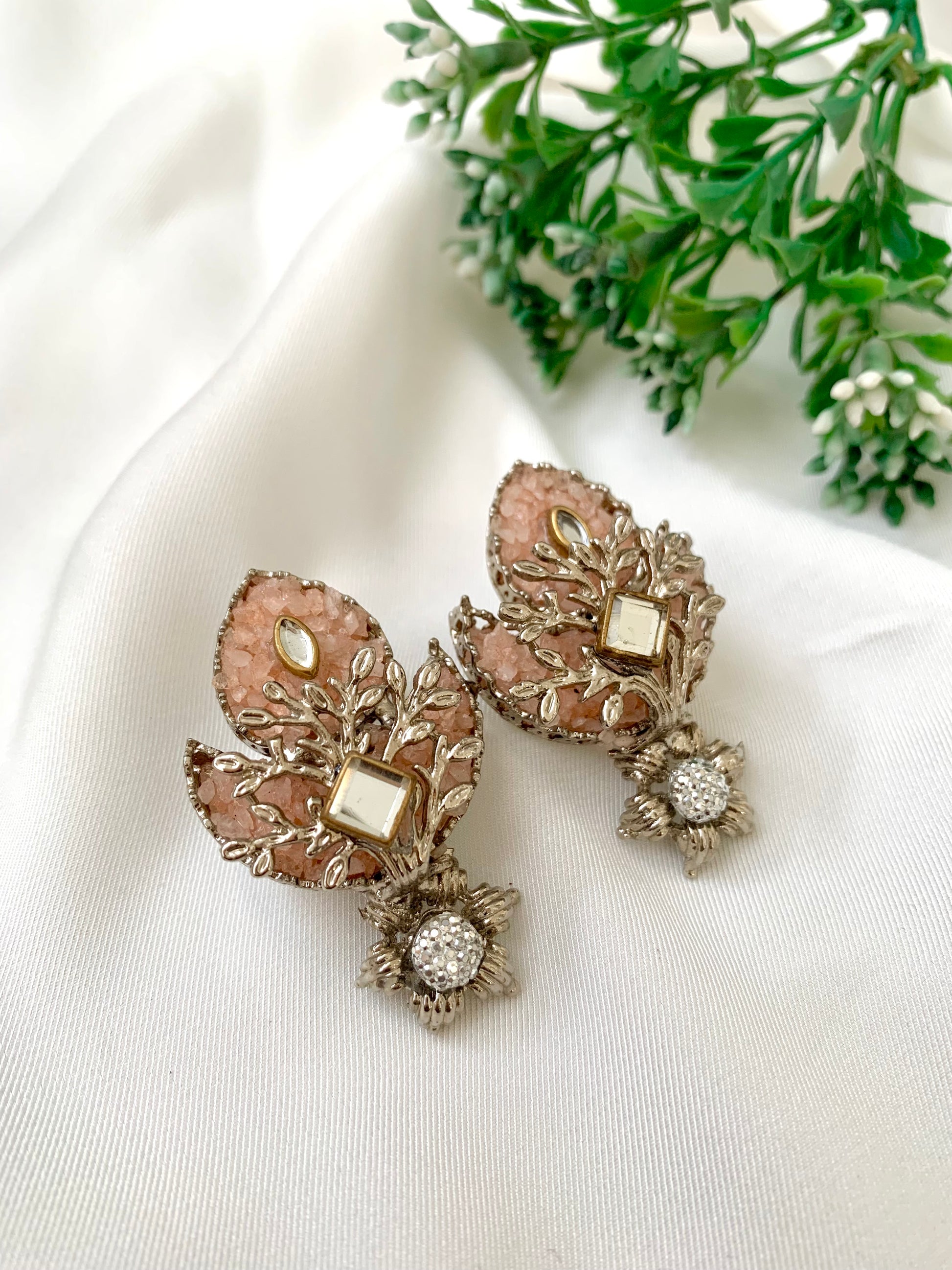 Naghma handcrafted earrings featuring American Diamonds, Kundan, and semi-precious Pearls, available in White (22kt gold plated) and Pink (rhodium plated) variants