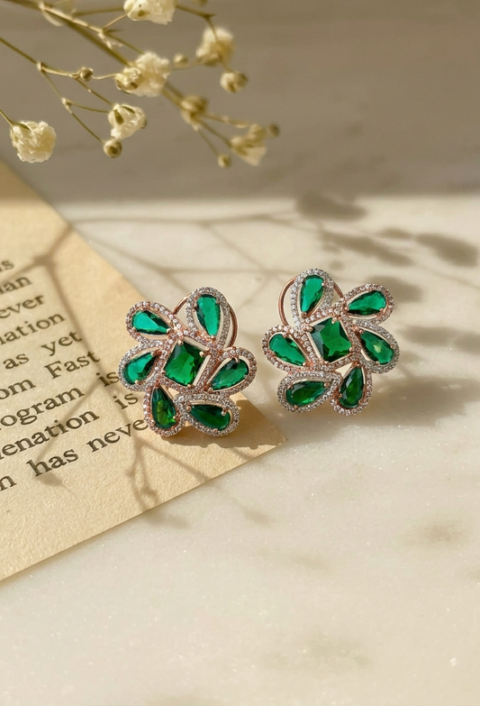 Naino rose gold plated studs with American diamonds and emerald accents