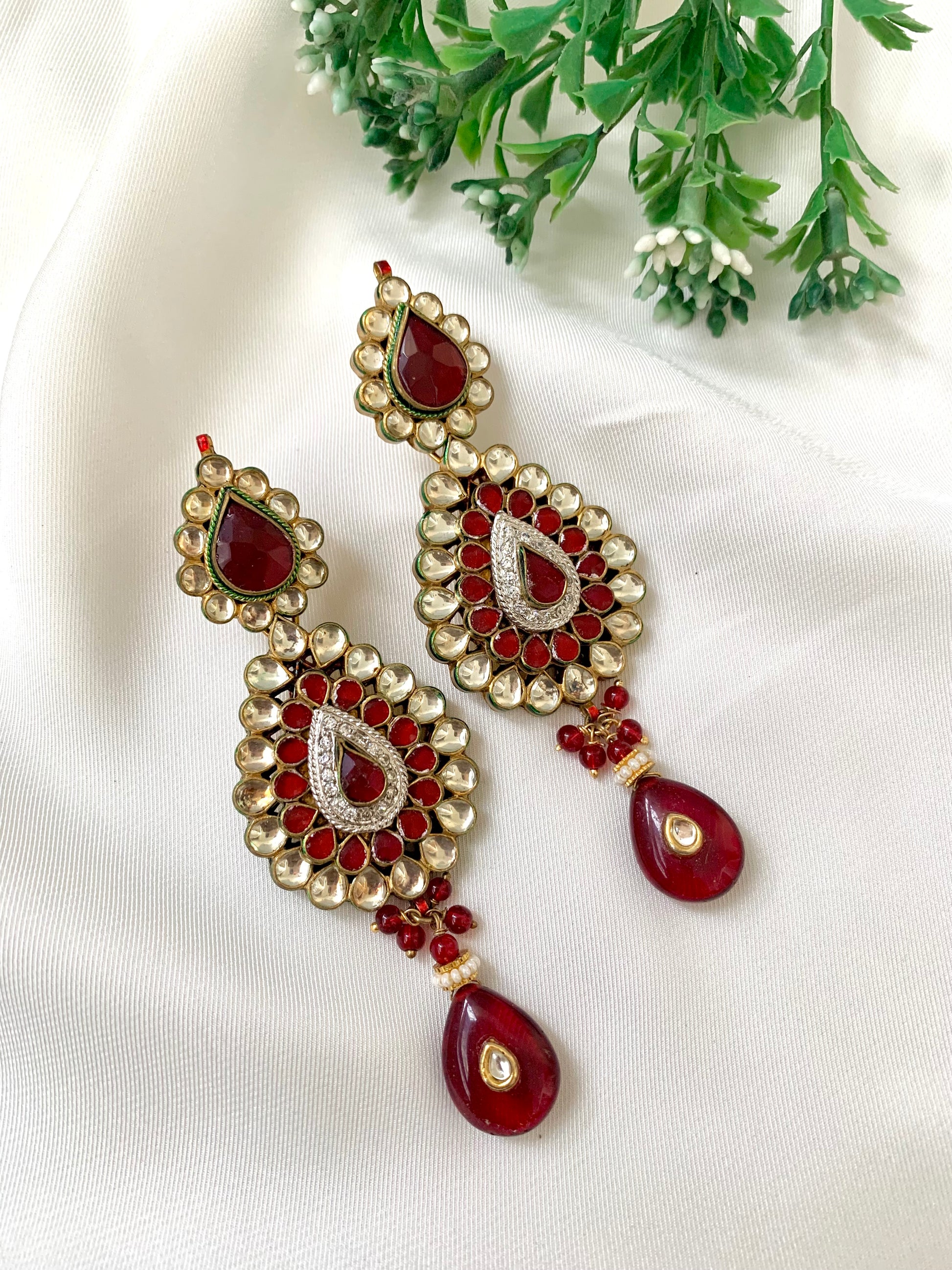 Naman handcrafted 22kt gold plated earrings featuring American Diamonds, Pachi Kundan, semi-precious Garnet, and Pearls