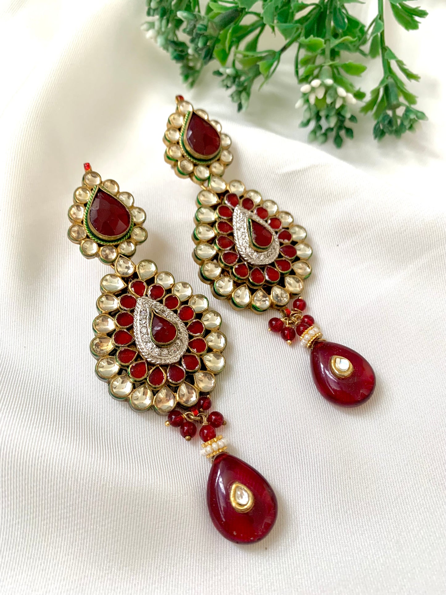Naman handcrafted 22kt gold plated earrings featuring American Diamonds, Pachi Kundan, semi-precious Garnet, and Pearls