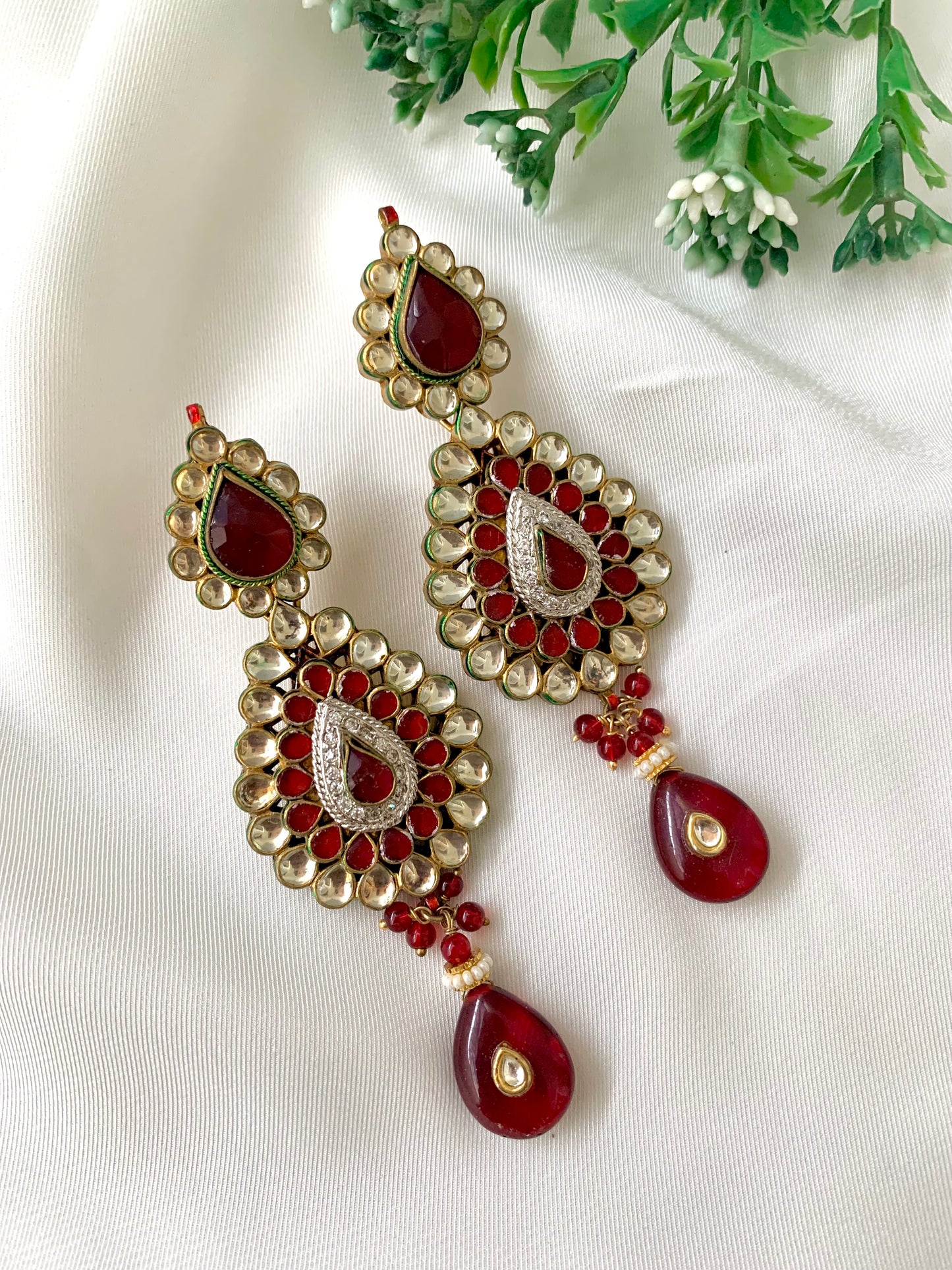 Naman handcrafted 22kt gold plated earrings featuring American Diamonds, Pachi Kundan, semi-precious Garnet, and Pearls