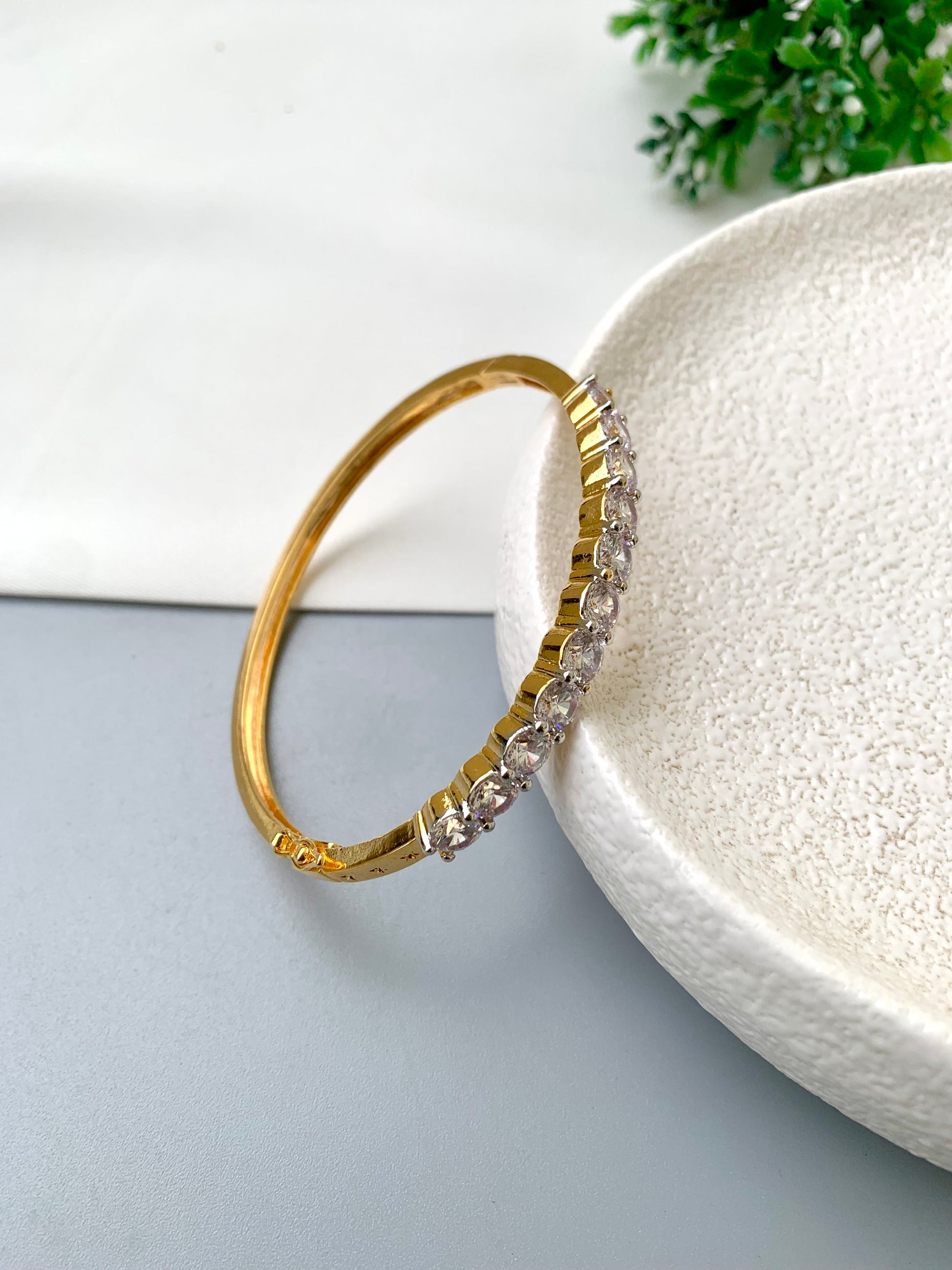 Nancy handcrafted American Diamond bracelet in 22kt gold and Rhodium platinum finish with delicate openable screw design