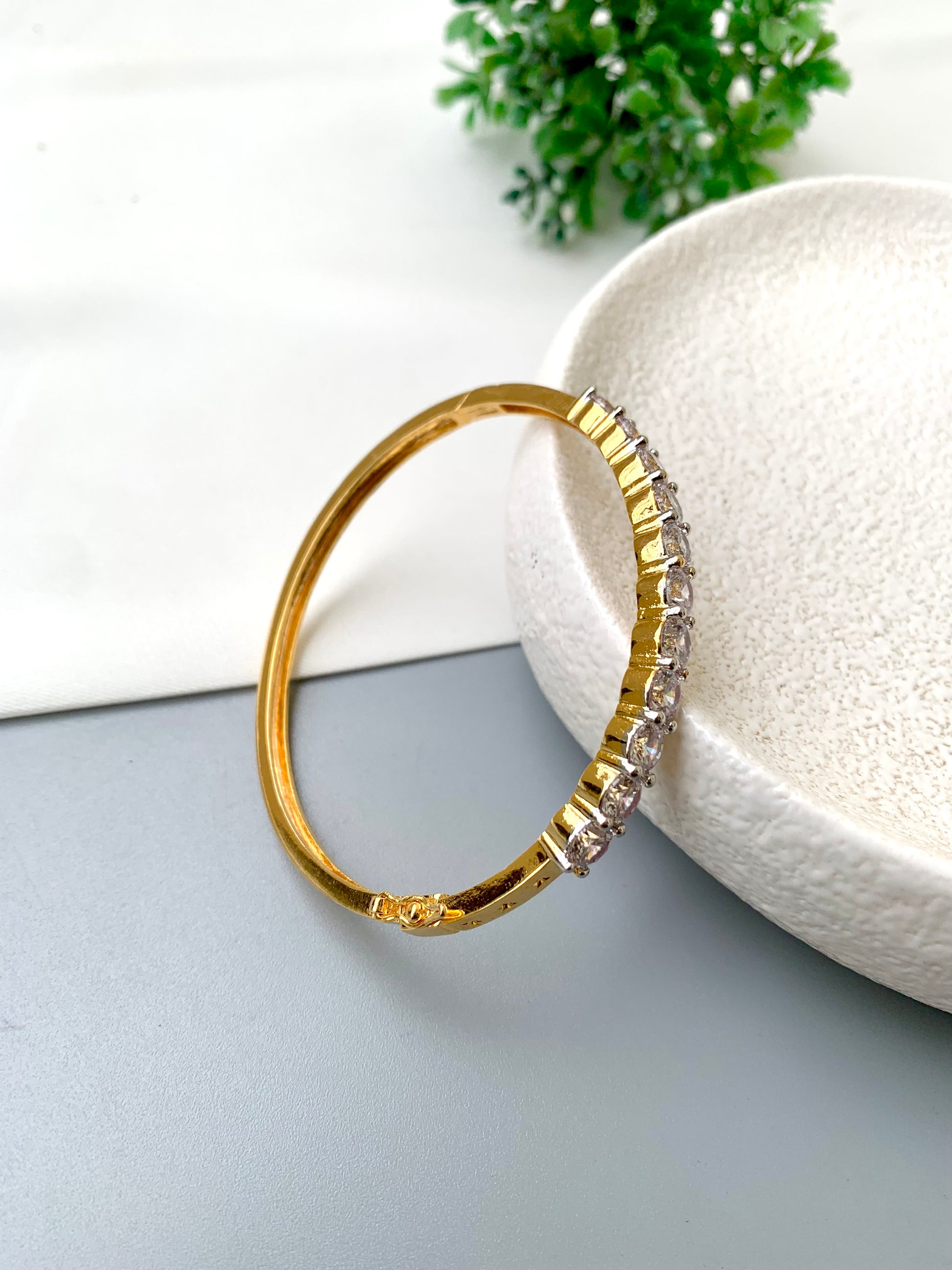 Nancy handcrafted American Diamond bracelet in 22kt gold and Rhodium platinum finish with delicate openable screw design