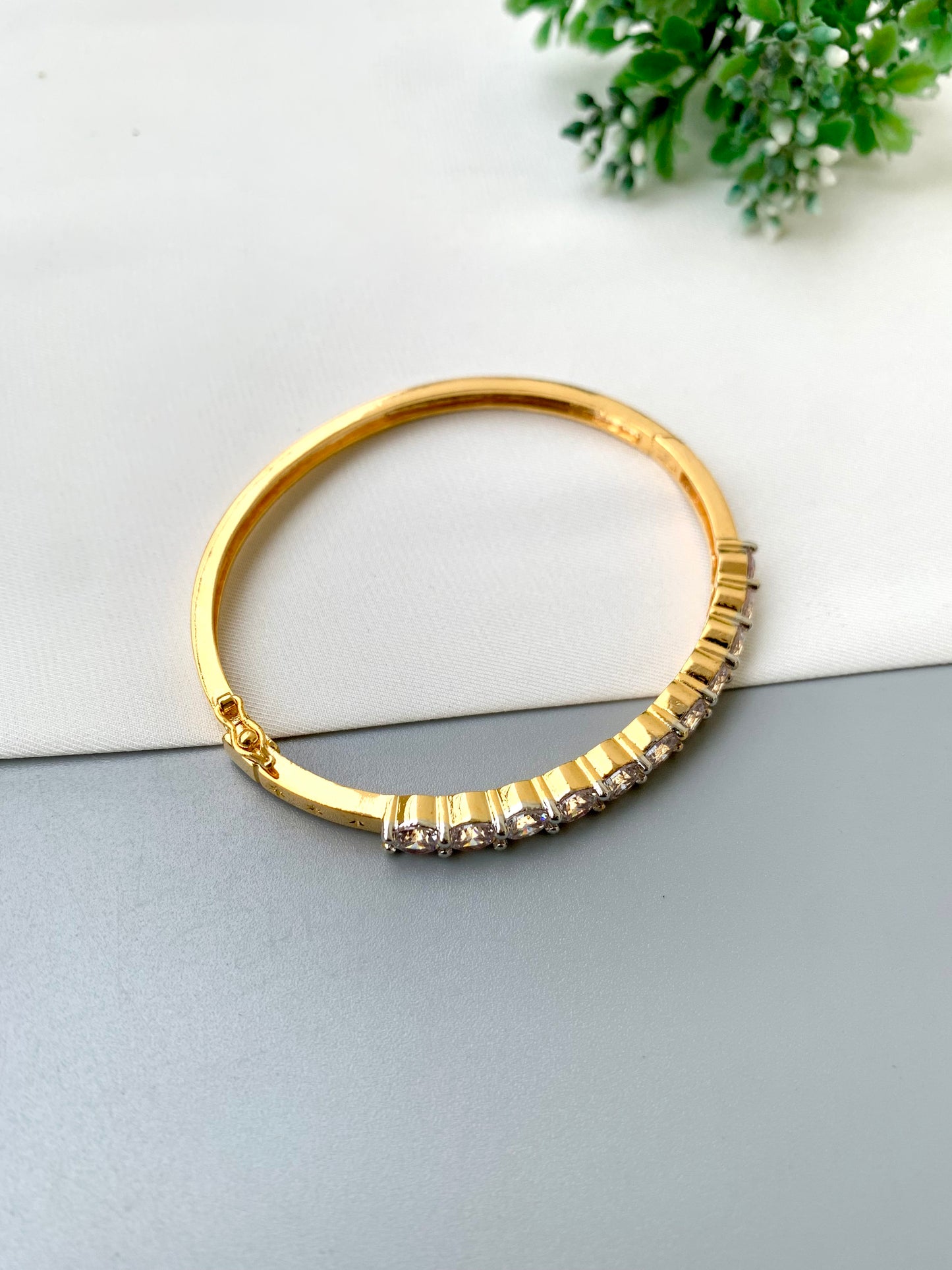 Nancy handcrafted American Diamond bracelet in 22kt gold and Rhodium platinum finish with delicate openable screw design