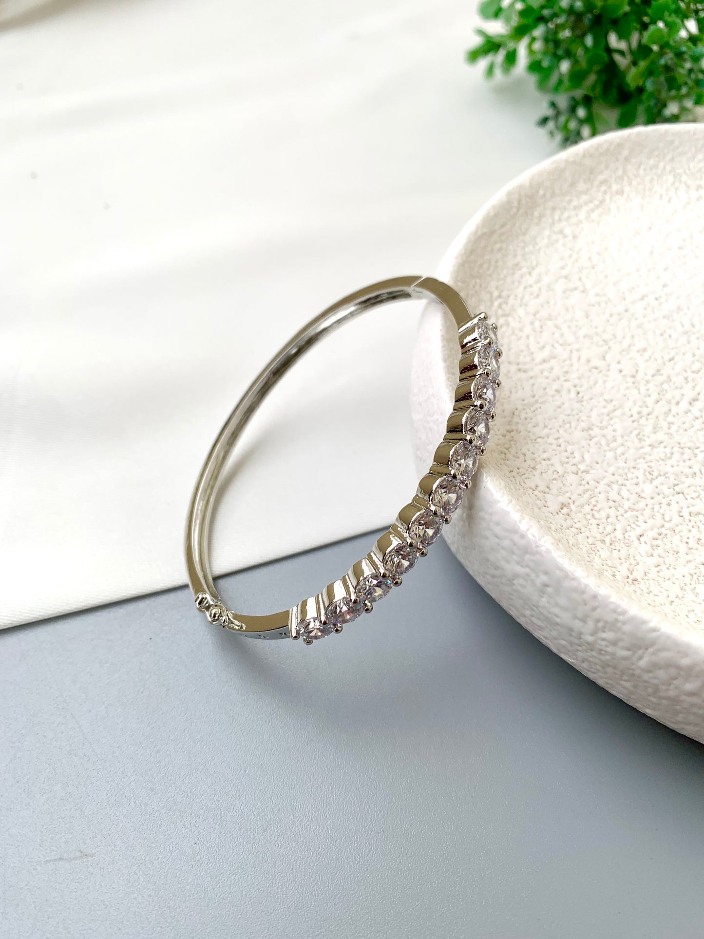 Nancy handcrafted American Diamond bracelet in 22kt gold and Rhodium platinum finish with delicate openable screw design