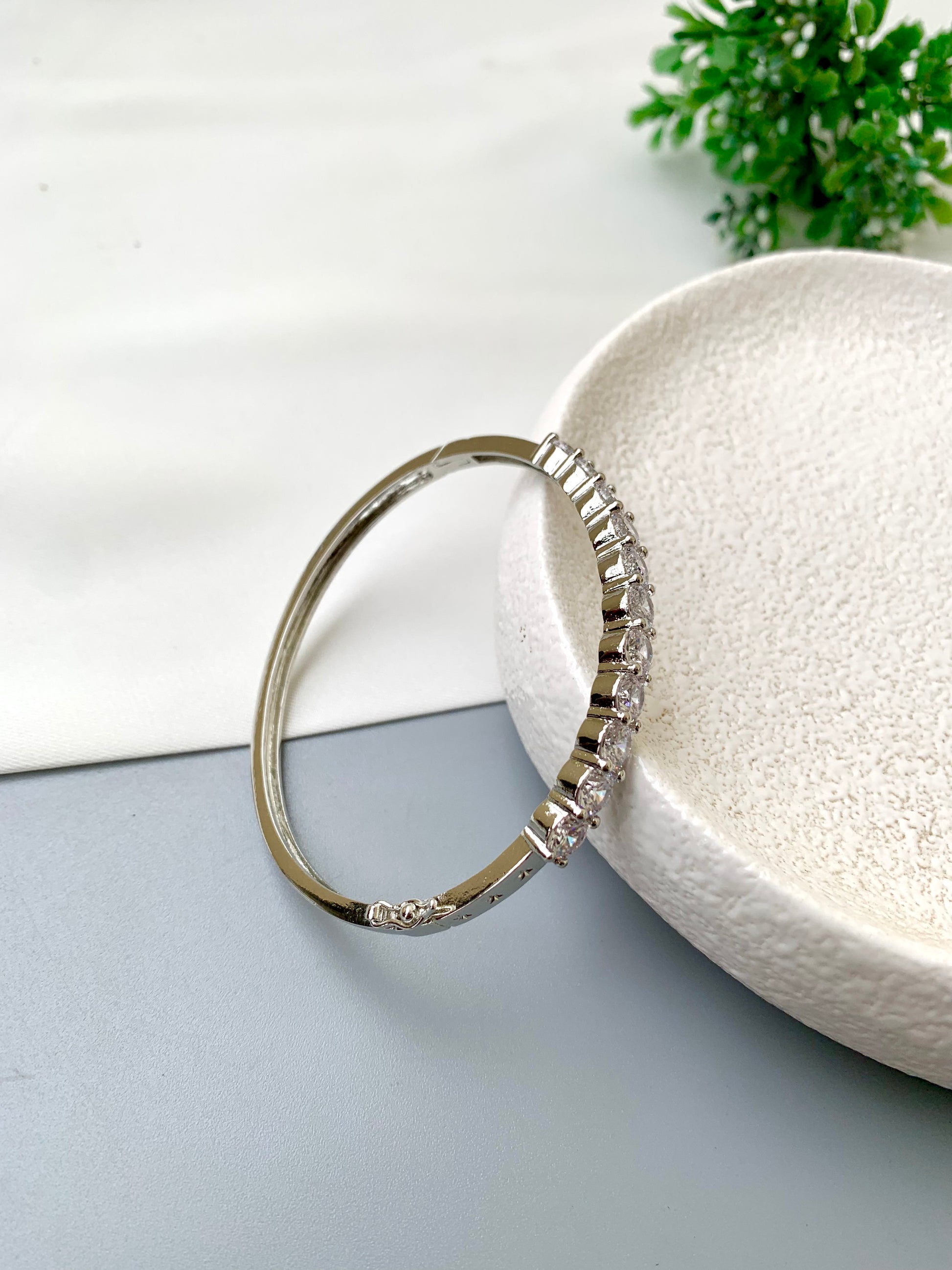 Nancy handcrafted American Diamond bracelet in 22kt gold and Rhodium platinum finish with delicate openable screw design