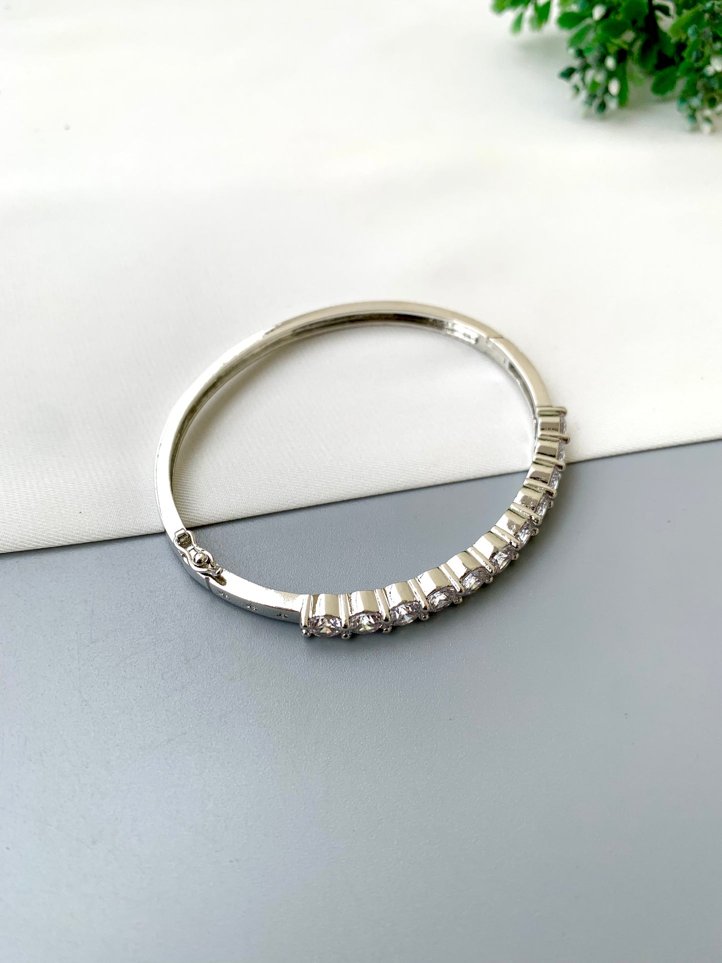 Nancy handcrafted American Diamond bracelet in 22kt gold and Rhodium platinum finish with delicate openable screw design
