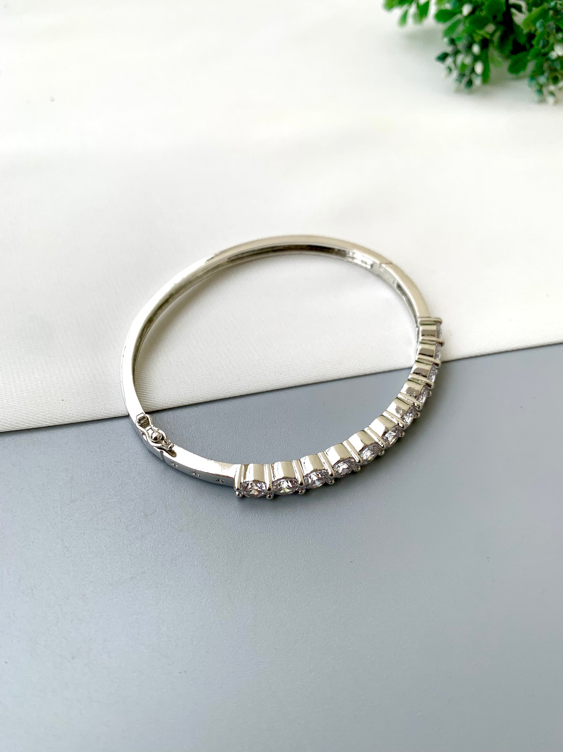 Nancy handcrafted American Diamond bracelet in 22kt gold and Rhodium platinum finish with delicate openable screw design