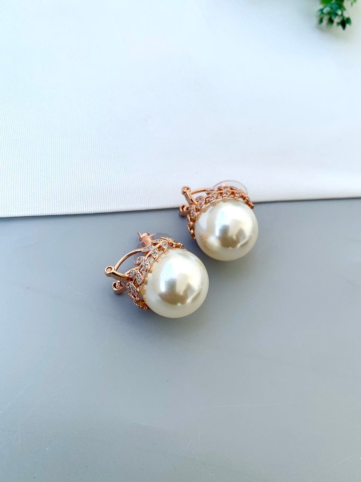 Naniya handcrafted 22kt Rose Gold plated studs with American Diamonds and semi-precious Pearls