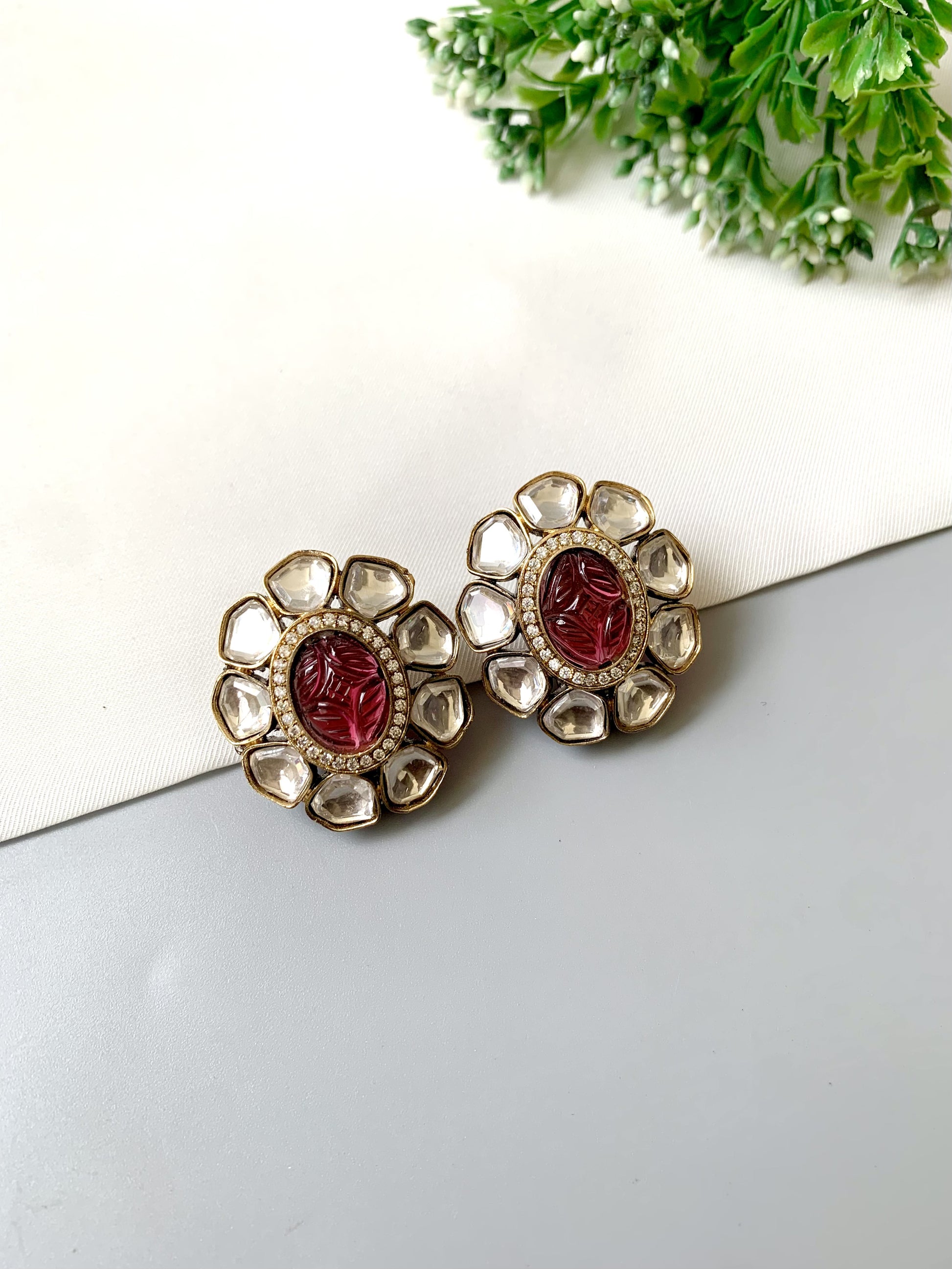 Nayab Studs with hand-carved Ruby, Polki Kundan and American Diamonds in 22kt Victorian Gold matte finish by Zamal Jewels.