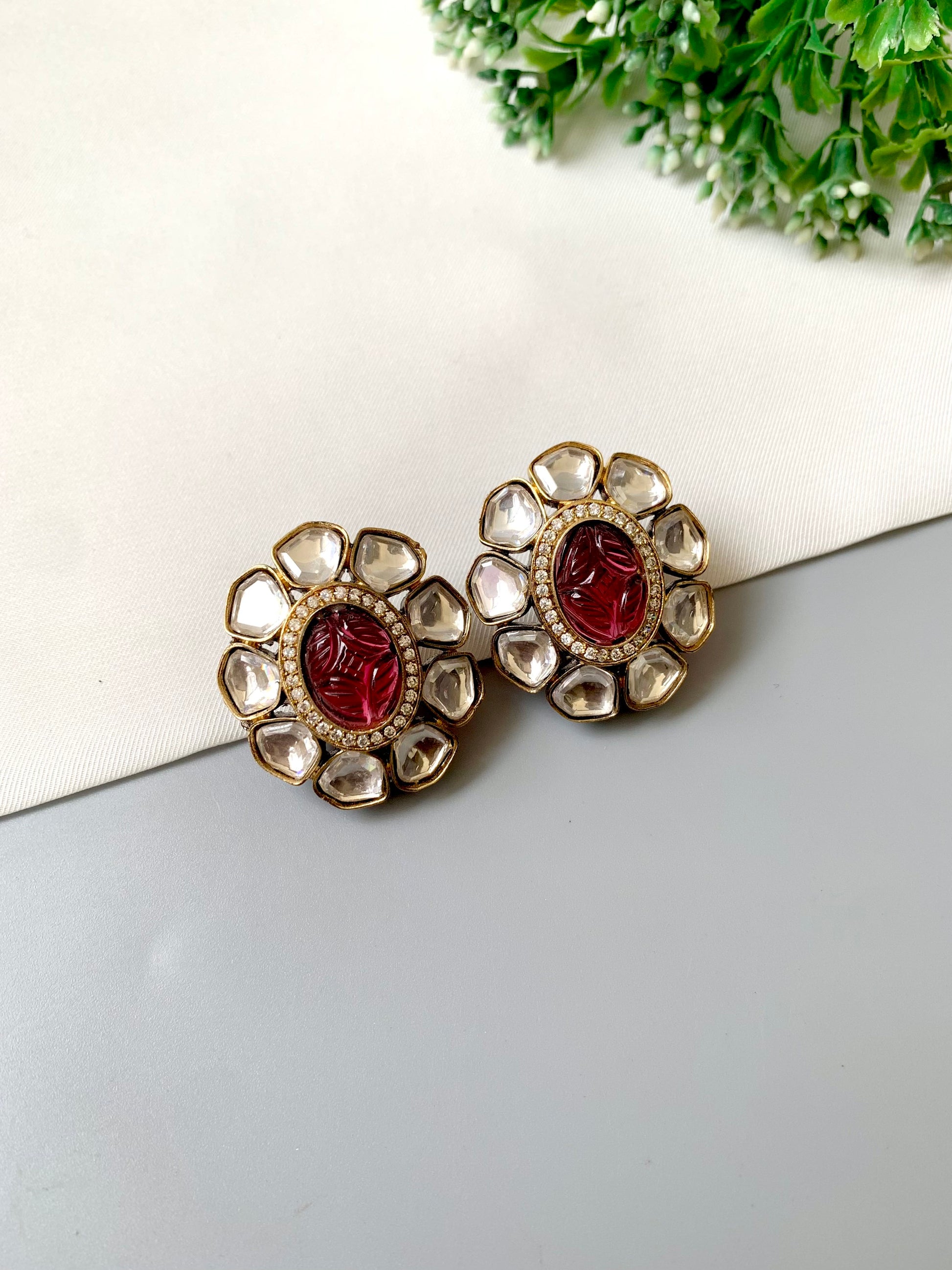 Nayab Studs with hand-carved Ruby, Polki Kundan and American Diamonds in 22kt Victorian Gold matte finish by Zamal Jewels.