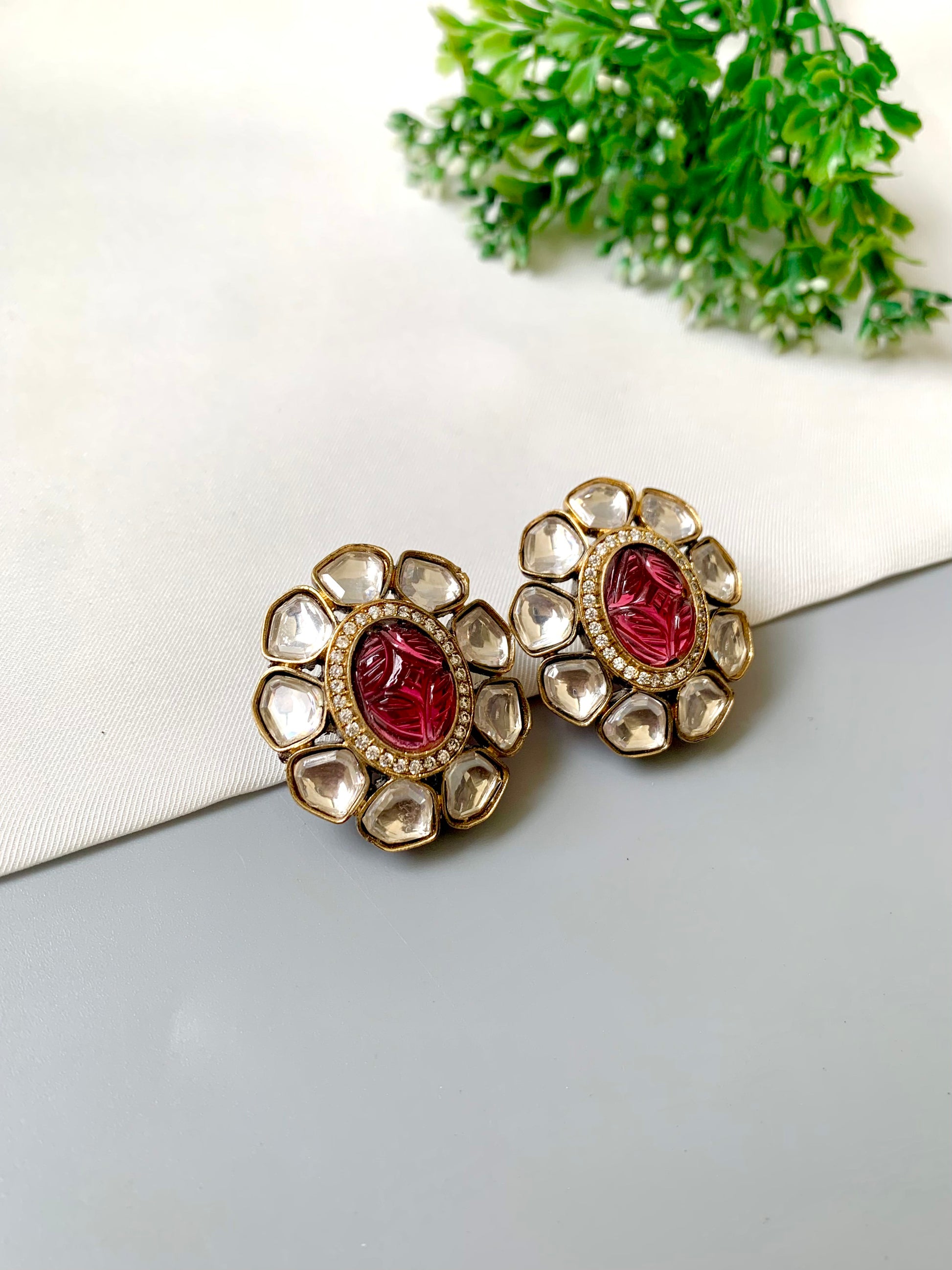 Nayab Studs with hand-carved Ruby, Polki Kundan and American Diamonds in 22kt Victorian Gold matte finish by Zamal Jewels.