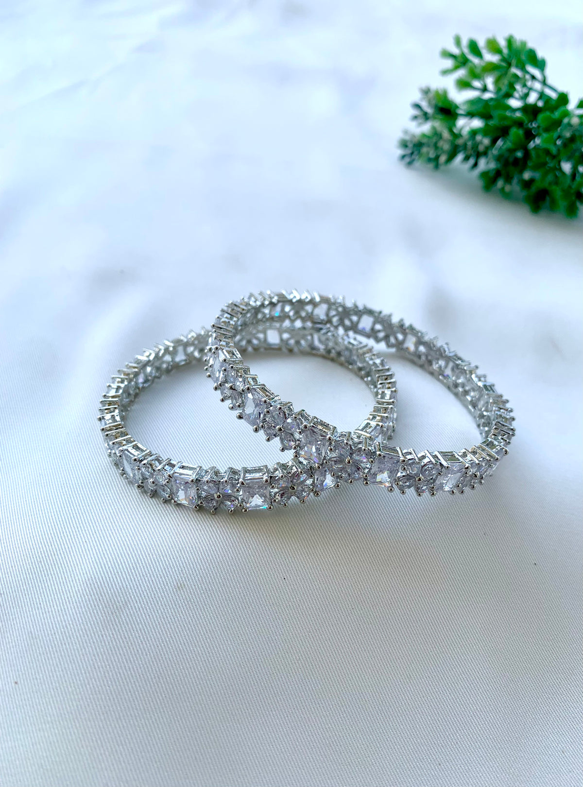 Nino handcrafted Rhodium plated slide-on bangles with American Diamonds