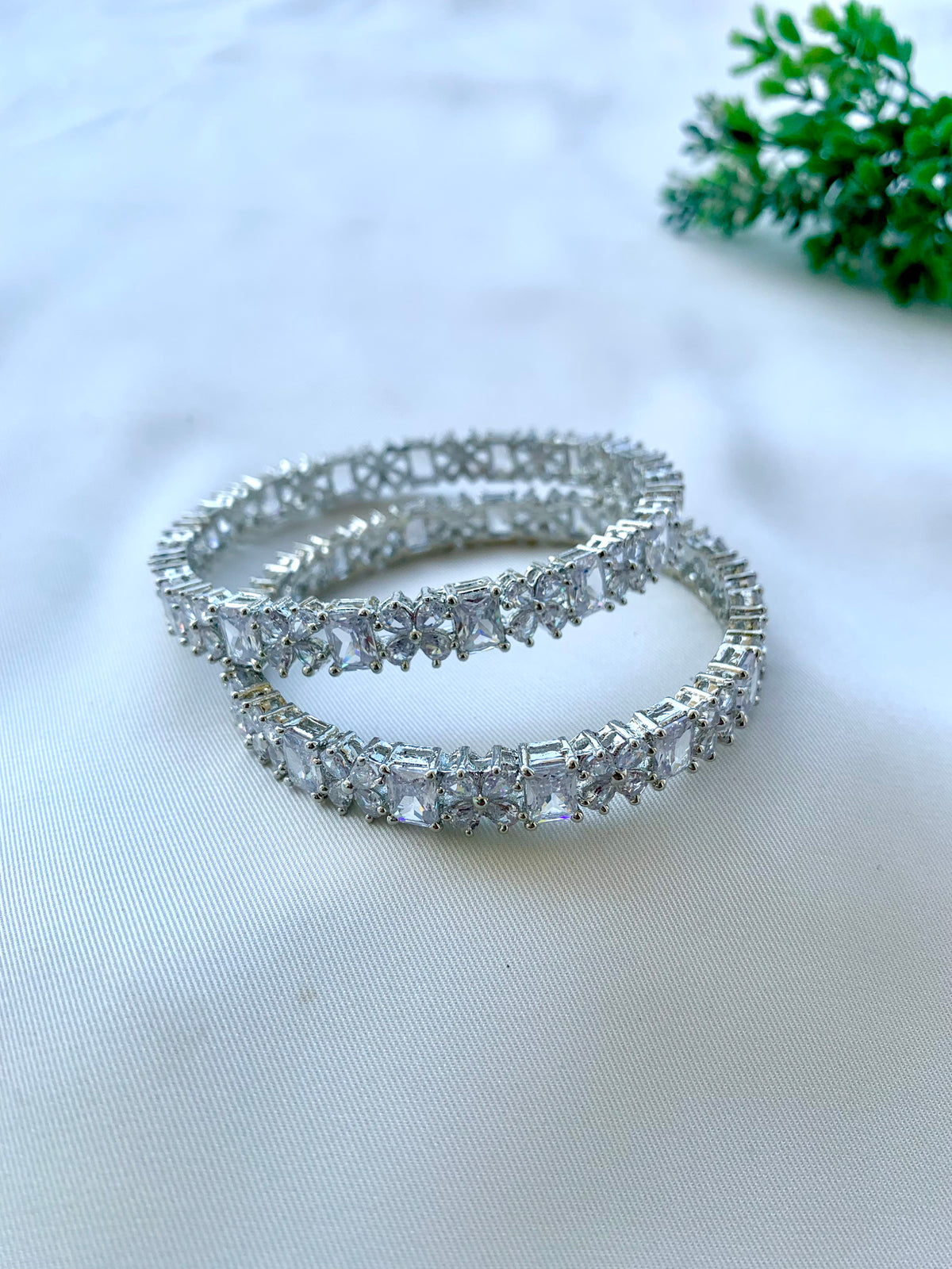 Nino handcrafted Rhodium plated slide-on bangles with American Diamonds