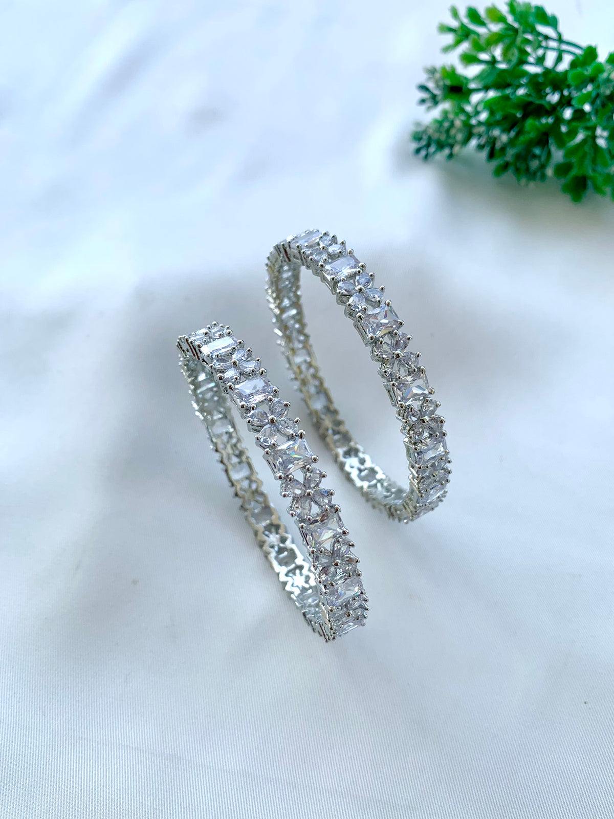 Nino handcrafted Rhodium plated slide-on bangles with American Diamonds