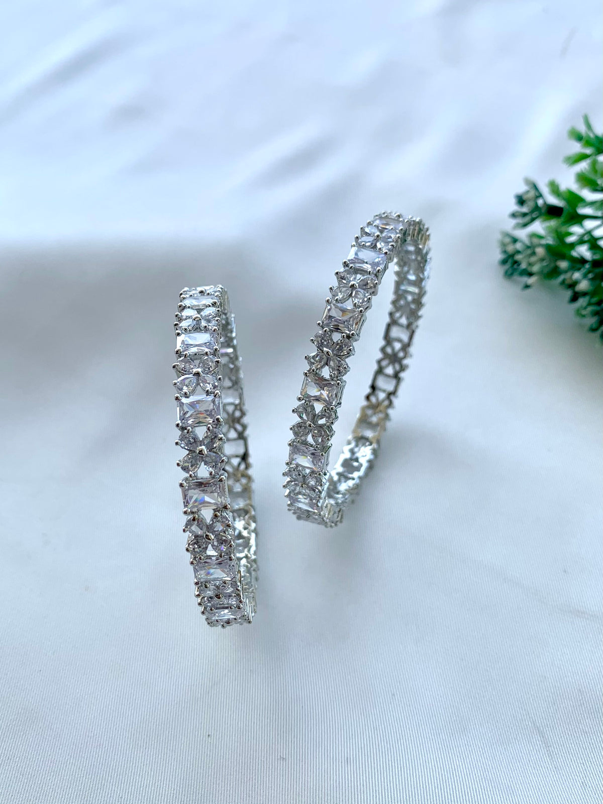 Nino handcrafted Rhodium plated slide-on bangles with American Diamonds