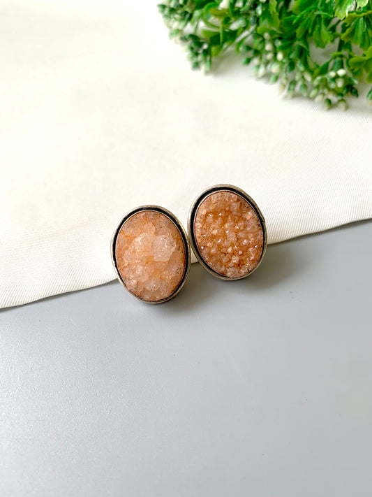 Nyra Soleil Druzy Studs in rhodium plating with natural peach druzy gemstone by Zamal Jewels