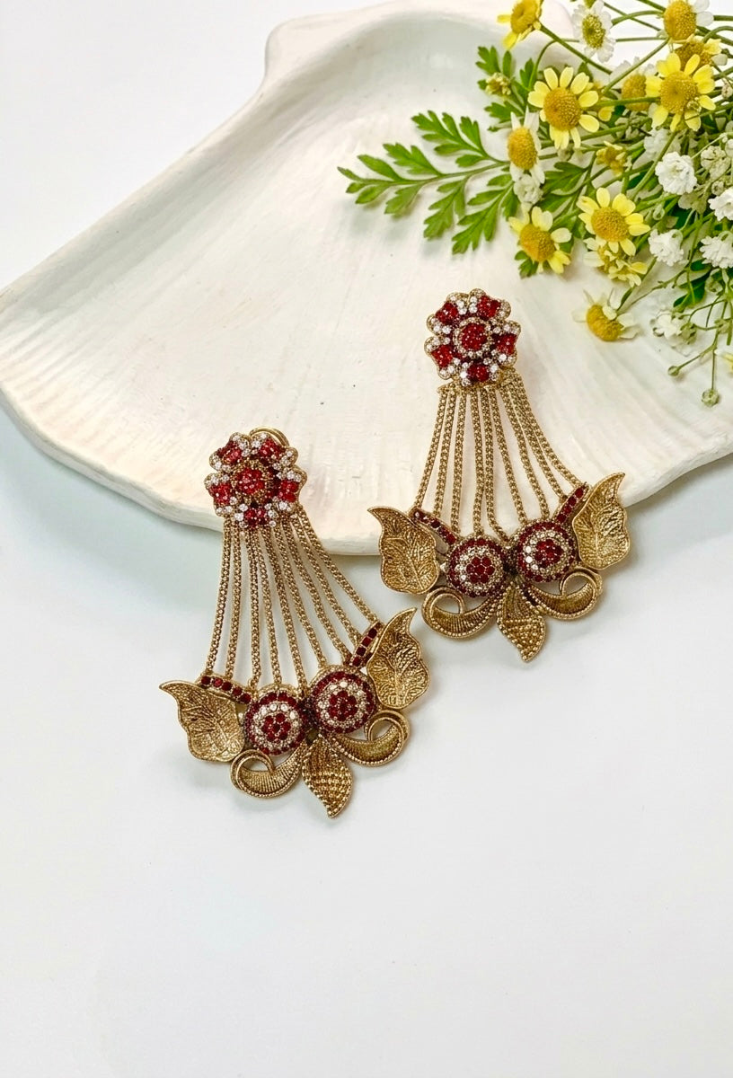 Parvati ruby jhoomar earrings in gold plating with American diamonds and gemstone detailing