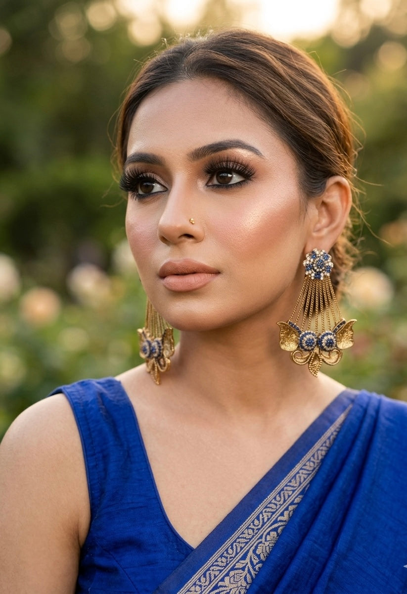 Parvati sapphire jhoomar earrings in gold plating with American diamonds and gemstone detailing