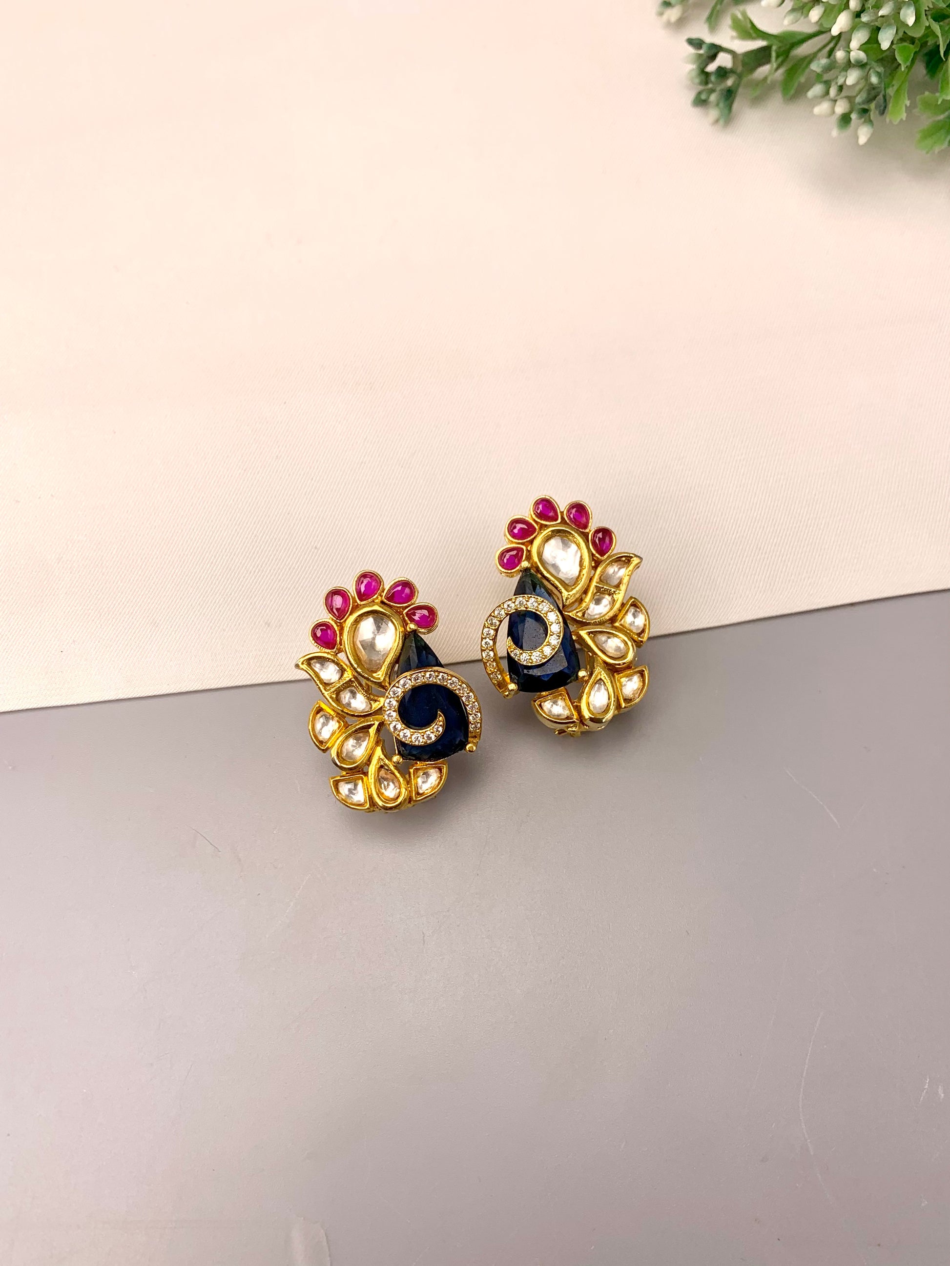 Rafa handcrafted 22kt gold plated studs featuring American Diamonds, Polki Kundan, semi-precious Sapphire, and Ruby