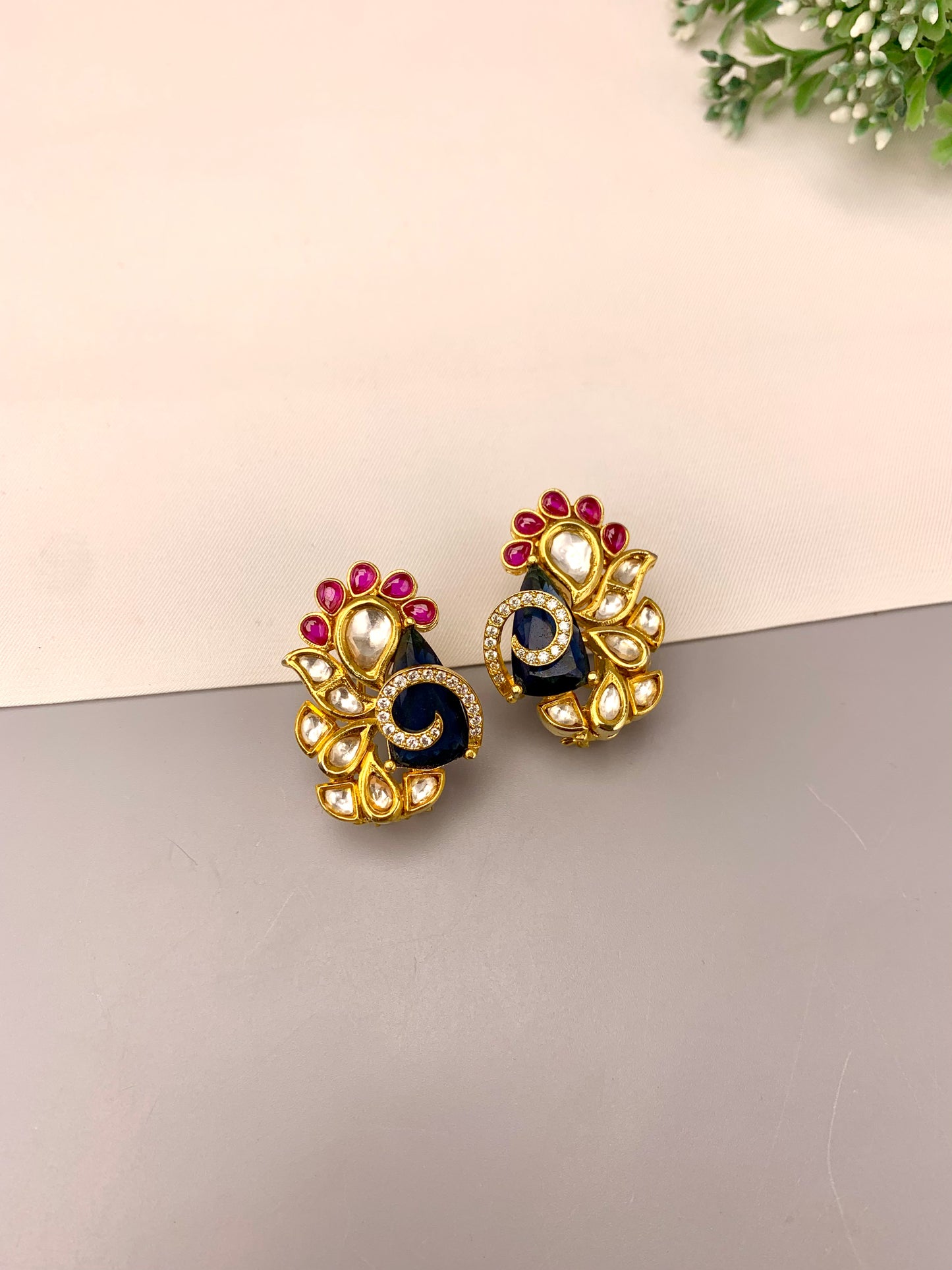 Rafa handcrafted 22kt gold plated studs featuring American Diamonds, Polki Kundan, semi-precious Sapphire, and Ruby