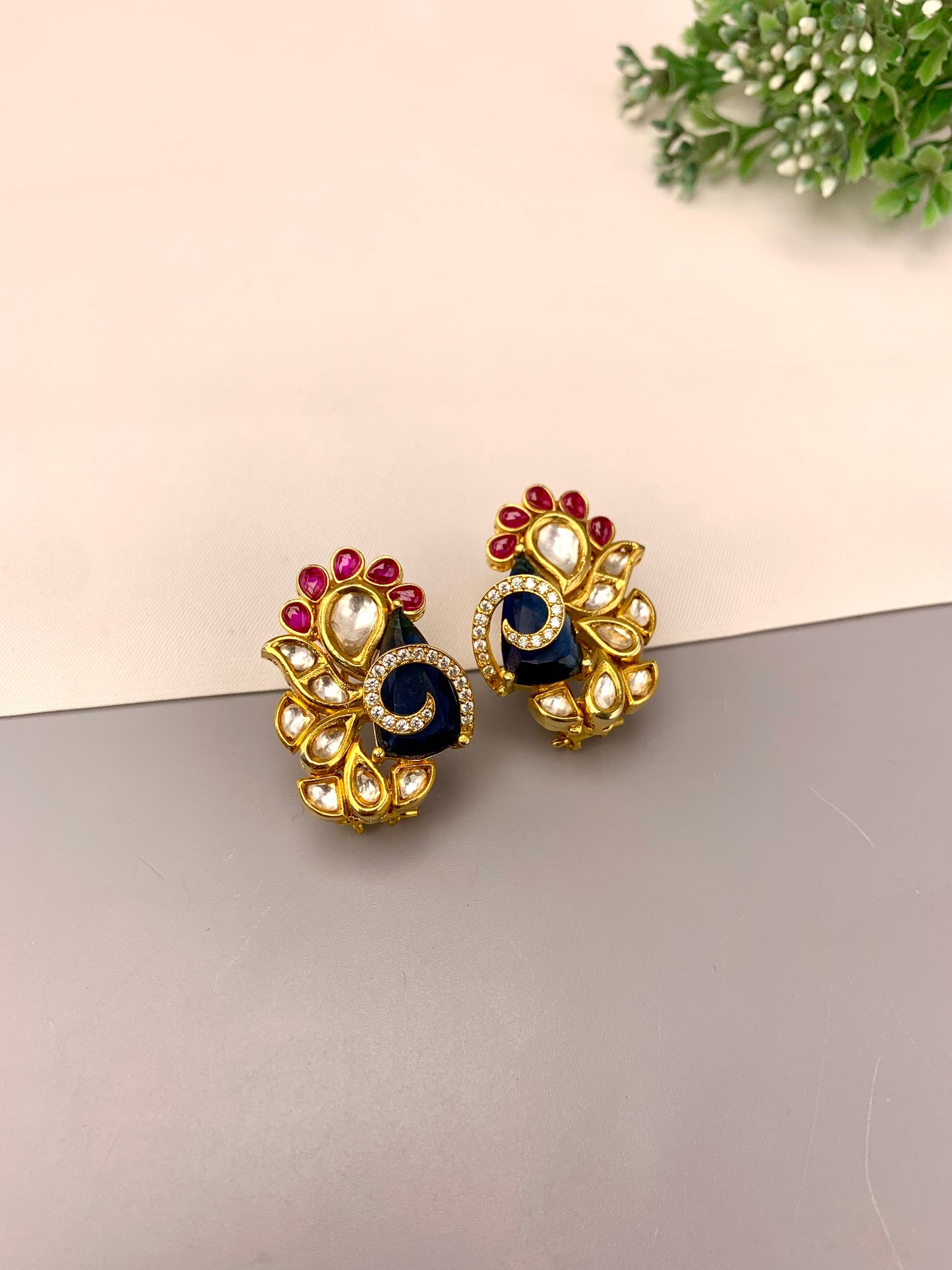 Rafa handcrafted 22kt gold plated studs featuring American Diamonds, Polki Kundan, semi-precious Sapphire, and Ruby