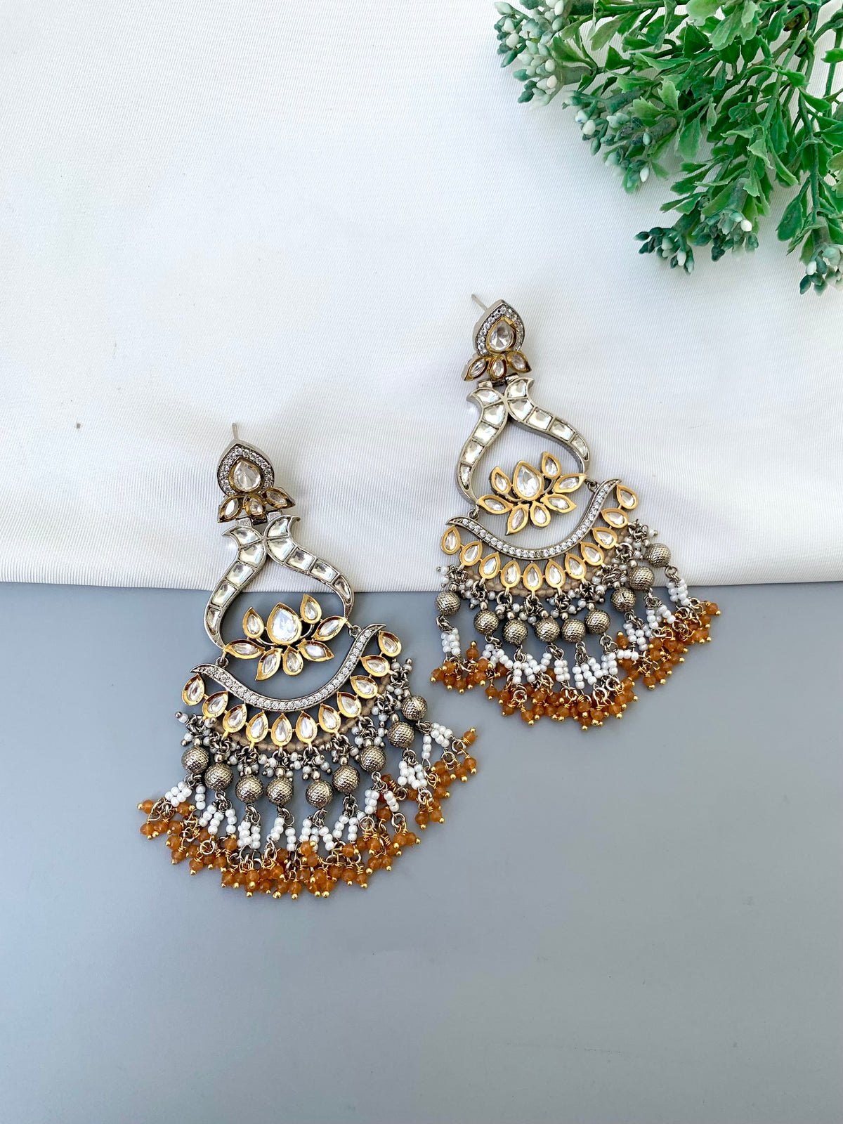 Rimah handcrafted 22kt Gold and Rhodium plated Polki Kundan earrings with Pearls and Onyx