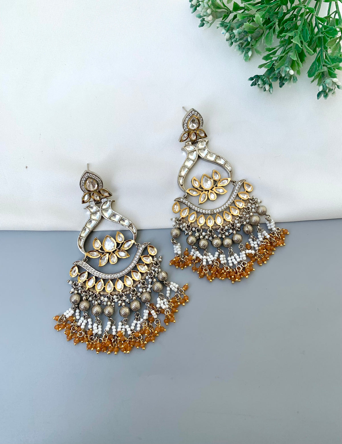 Rimah handcrafted 22kt Gold and Rhodium plated Polki Kundan earrings with Pearls and Onyx