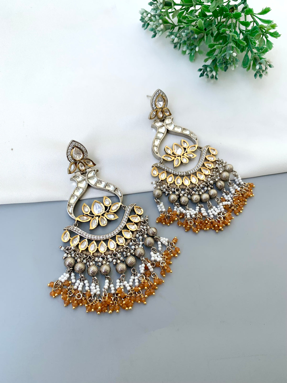 Rimah handcrafted 22kt Gold and Rhodium plated Polki Kundan earrings with Pearls and Onyx