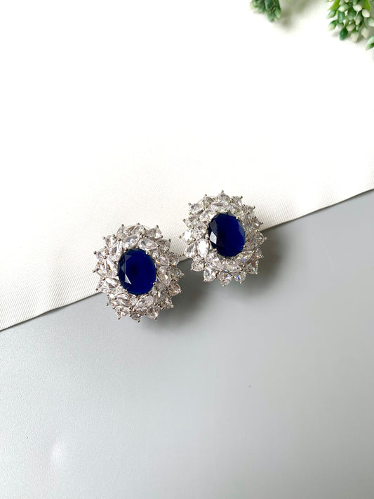 Rhodium plated Sapphire Studs with American Diamonds in a luxury halo setting