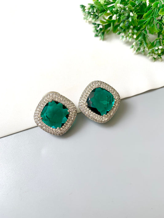 Selara Emerald Studs with American Diamonds & Semi-Precious Swarovski Emerald Crystal in cushion-cut halo design by Zamal Jewels