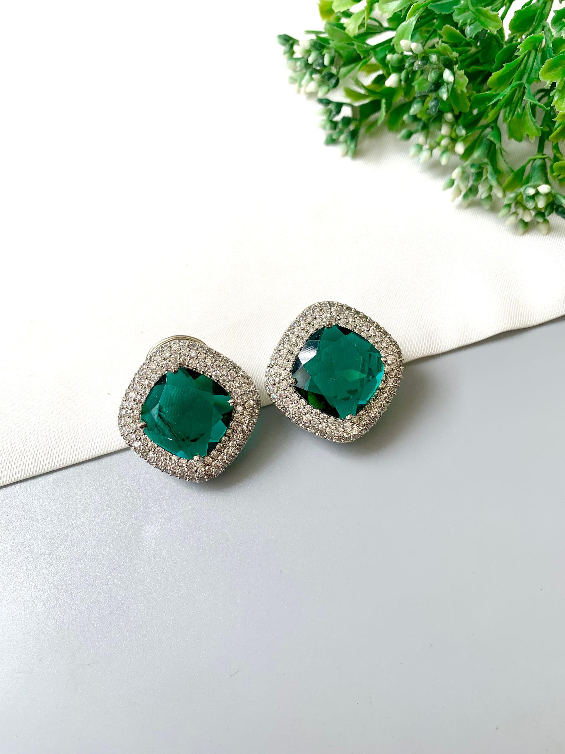 Selara Emerald Studs with American Diamonds & Semi-Precious Swarovski Emerald Crystal in cushion-cut halo design by Zamal Jewels