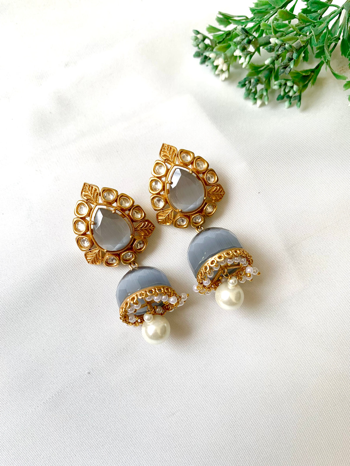 Seren handcrafted 22kt gold plated Jhumka featuring Polki Kundan, semi-precious Grey Onyx and Pearls